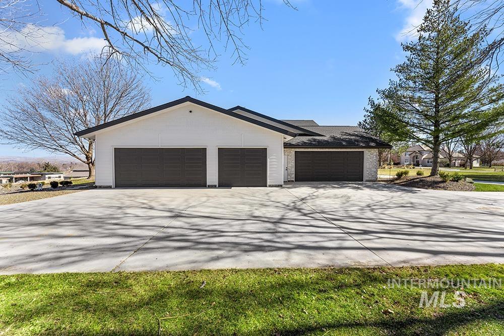 View of home's exterior with driveway and an attached garage