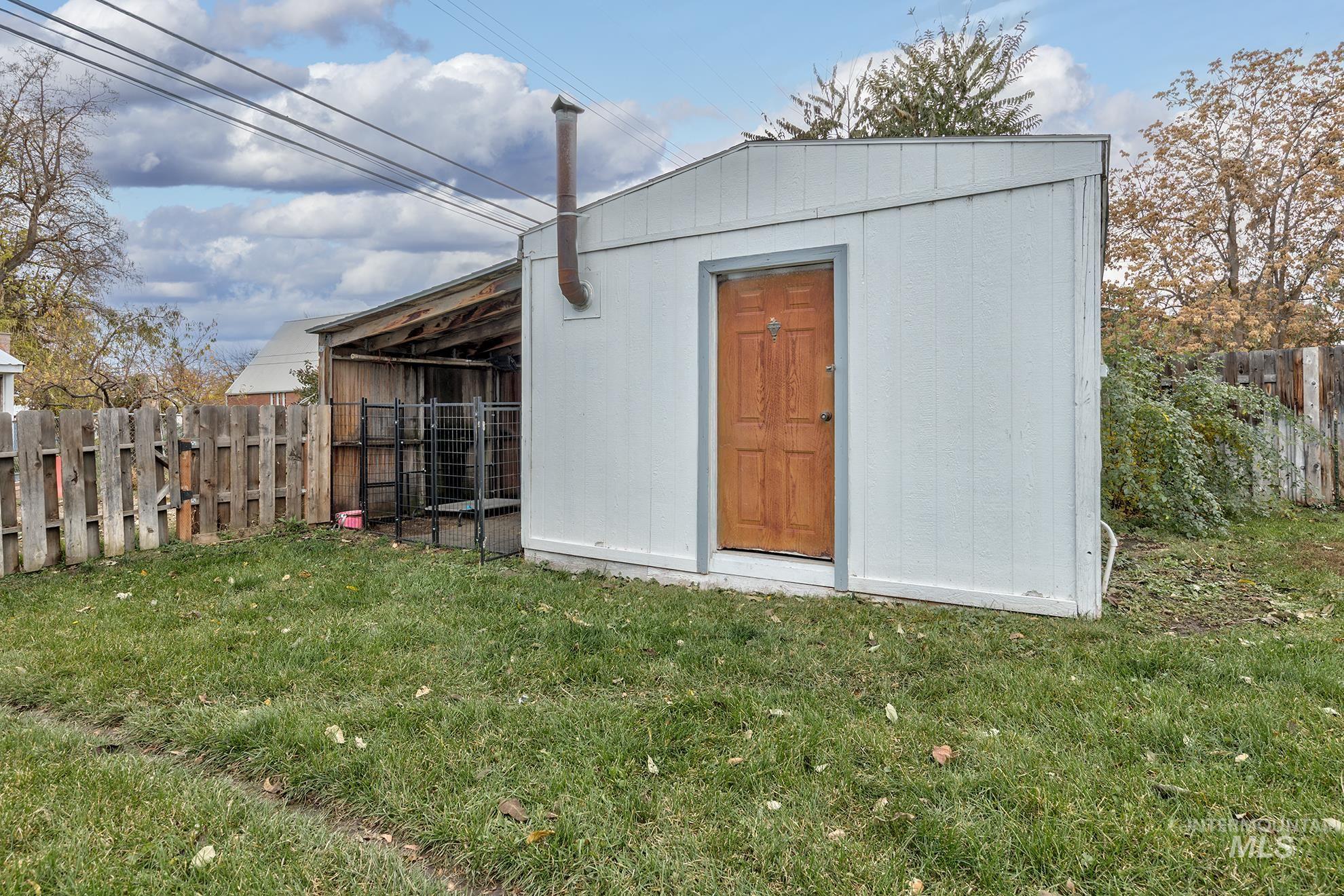 View of shed with a fenced backyard