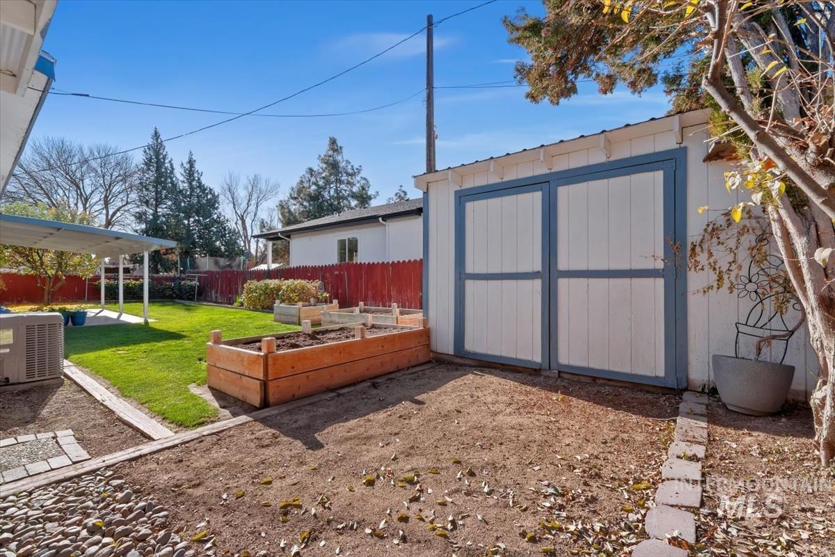 View of shed featuring a garden