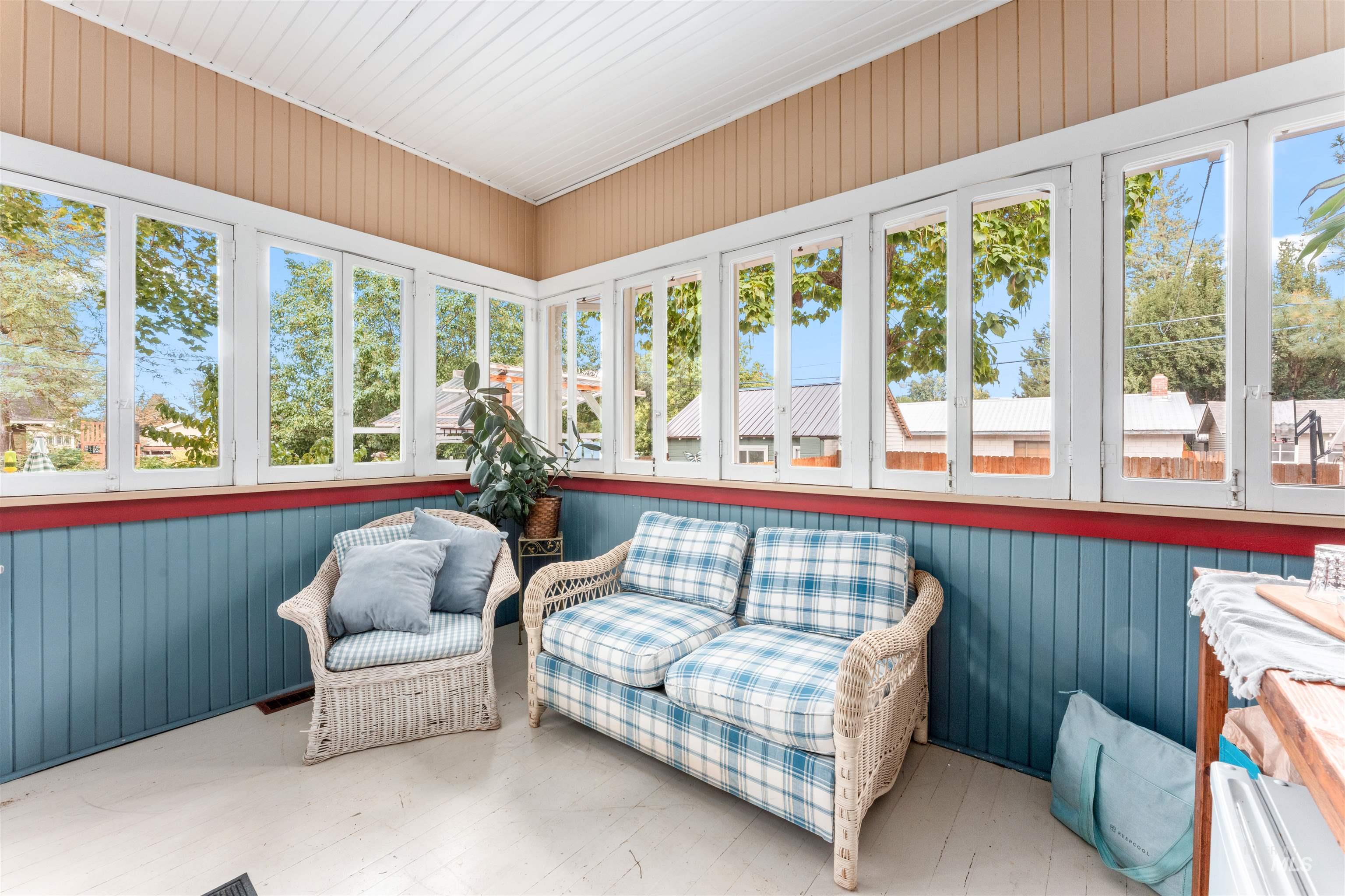 Sunroom with wood walls