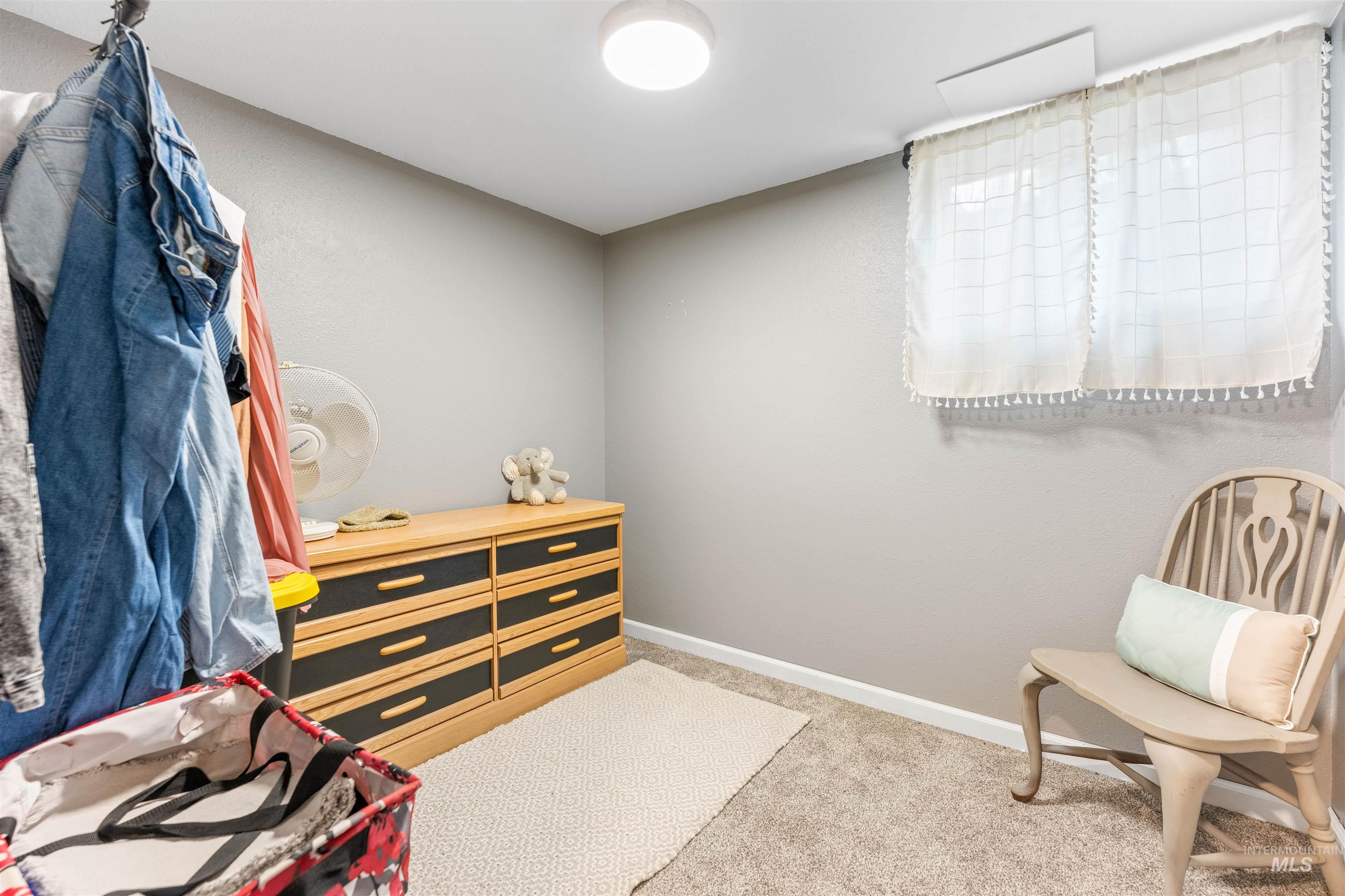 Bedroom with light carpet