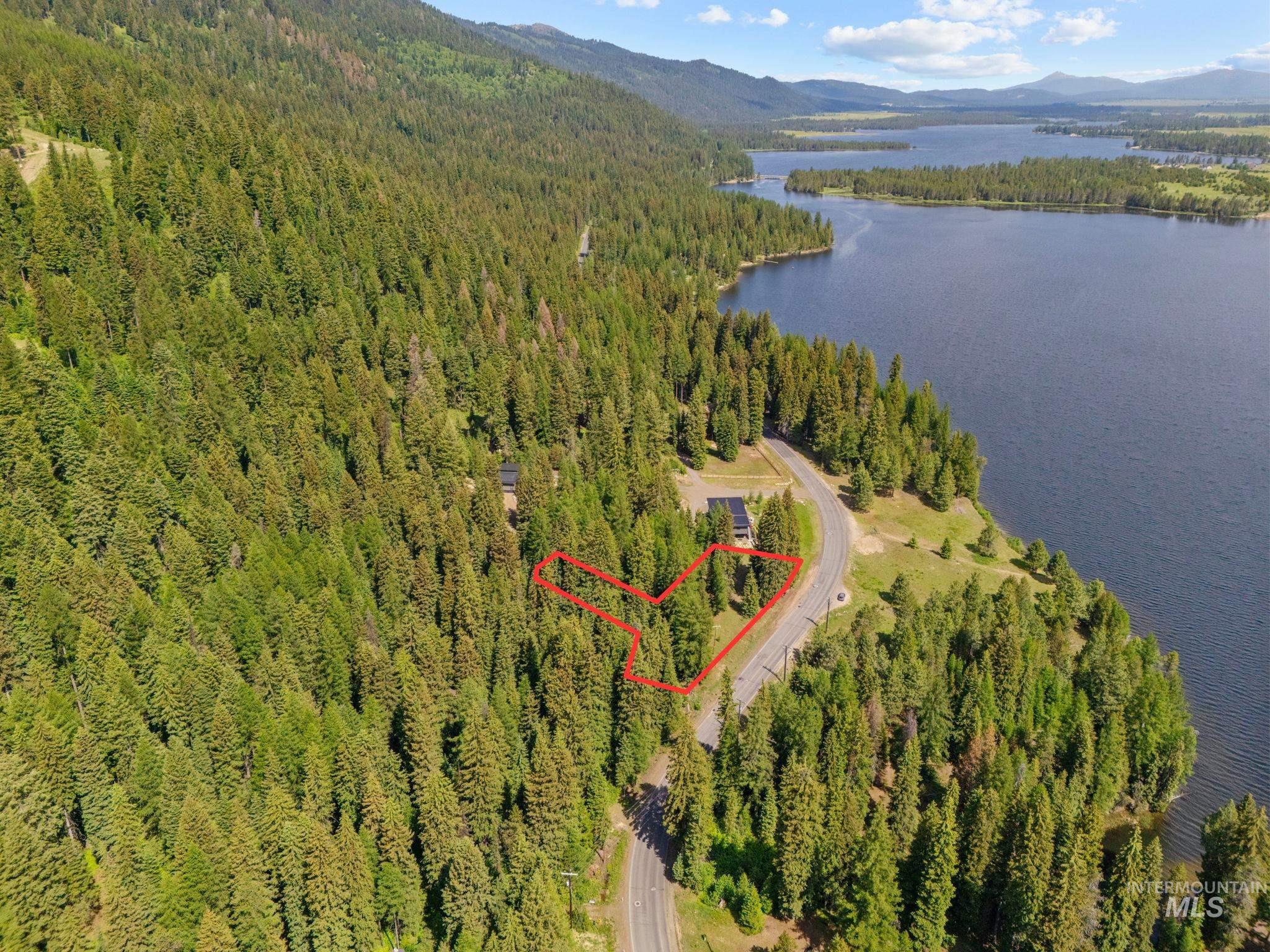 View of property location with a water and mountain view and property parcel outlined