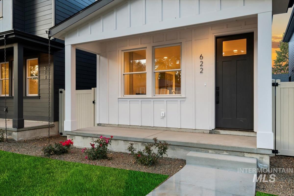 View of exterior entry with board and batten siding