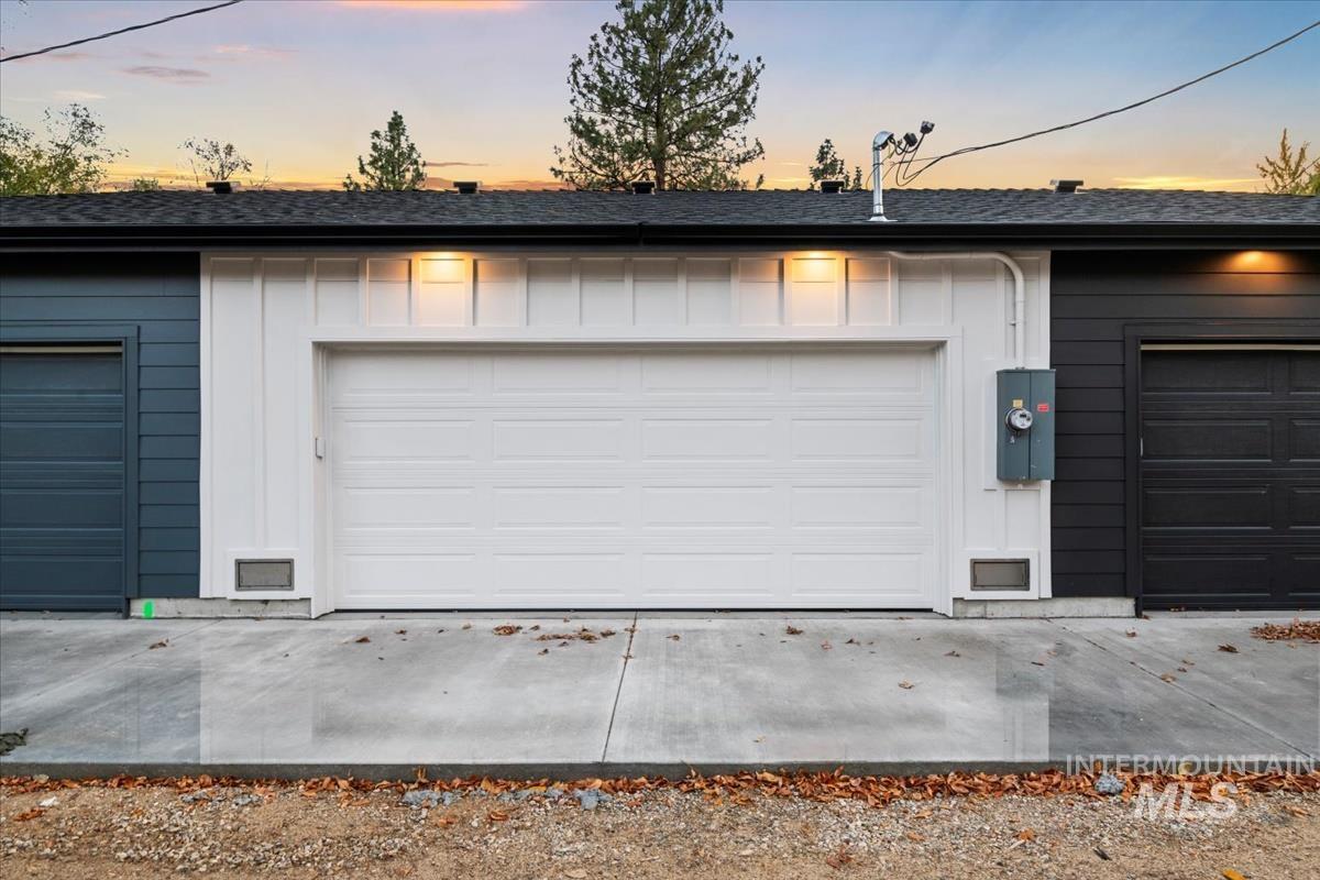 View of garage at dusk
