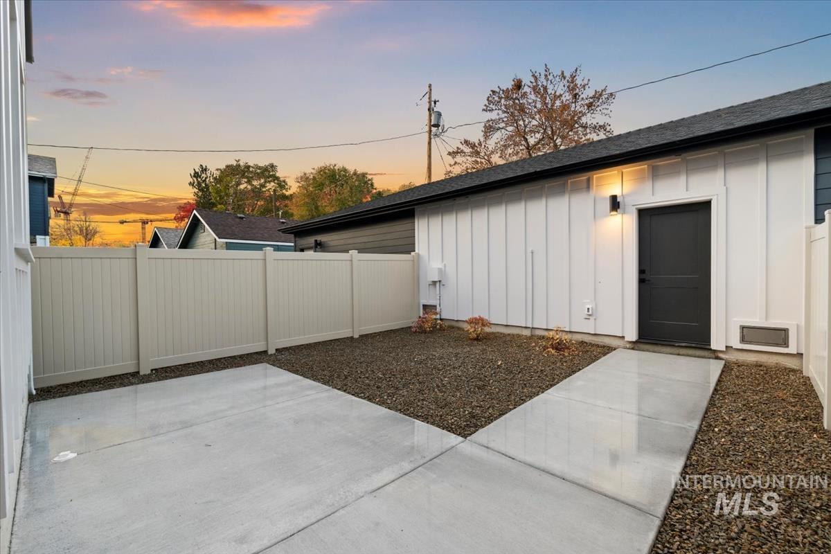 Property exterior at dusk featuring board and batten siding