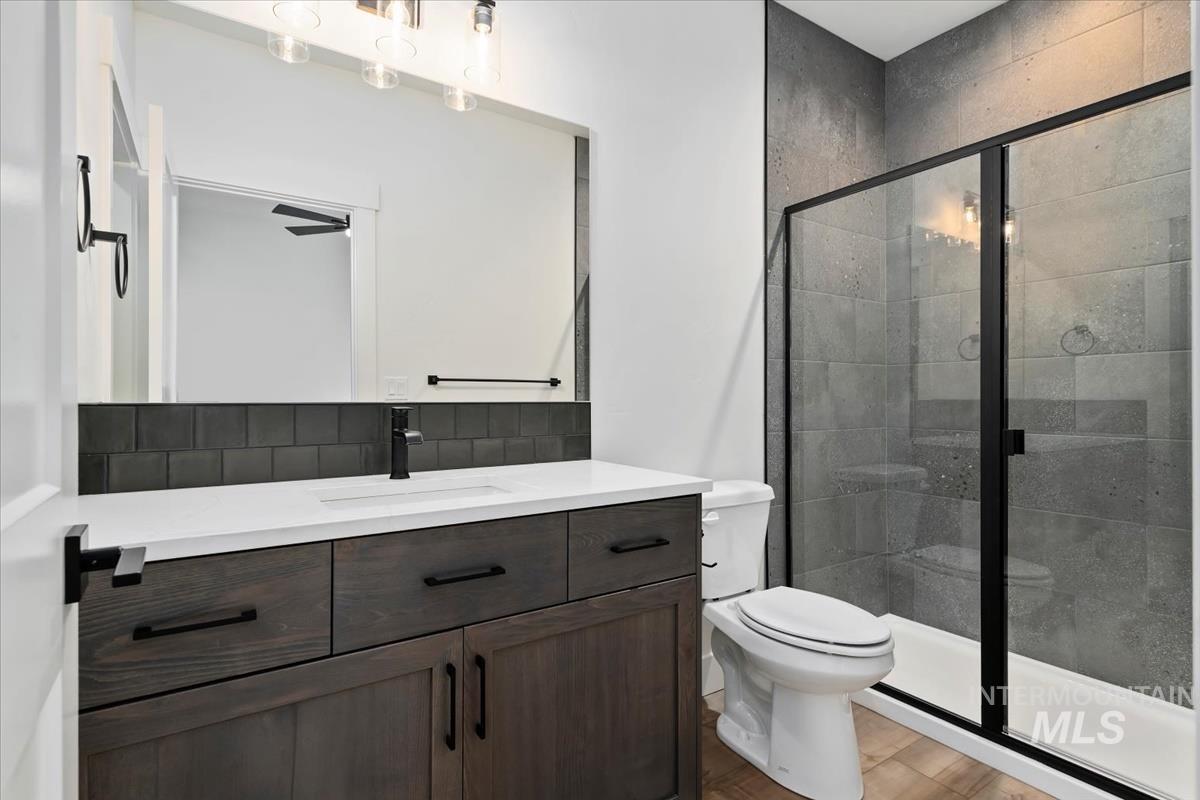 Bathroom with vanity and a shower stall