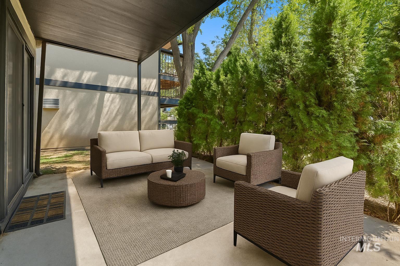 Sunroom / solarium featuring a patio and an outdoor hangout area