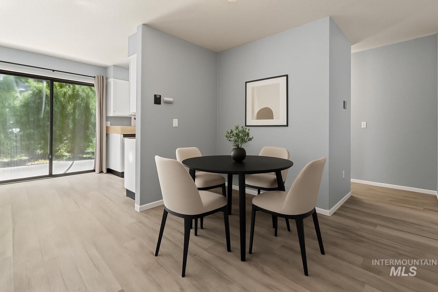 Dining room with light wood-style floors