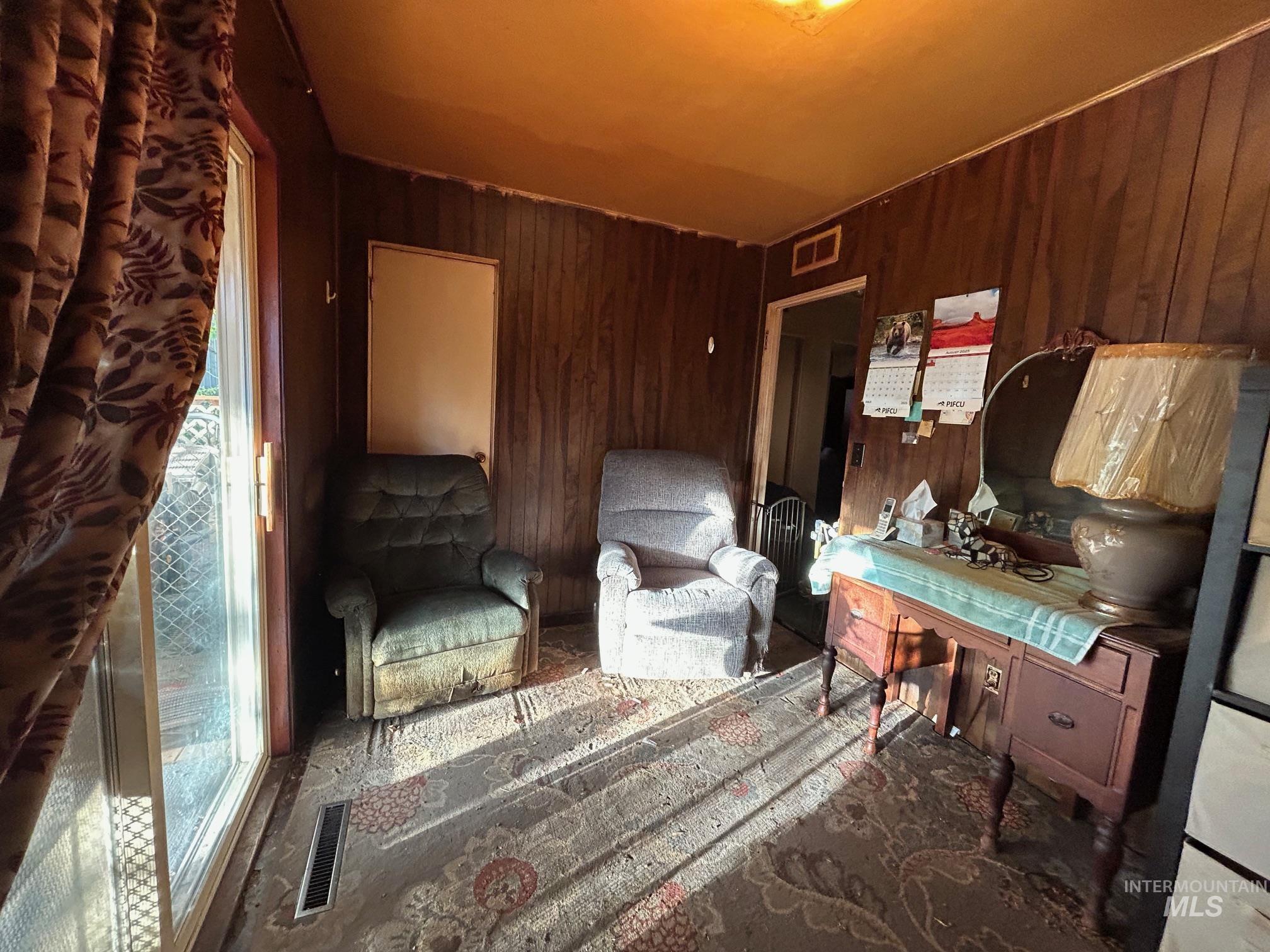 Office area with wood walls