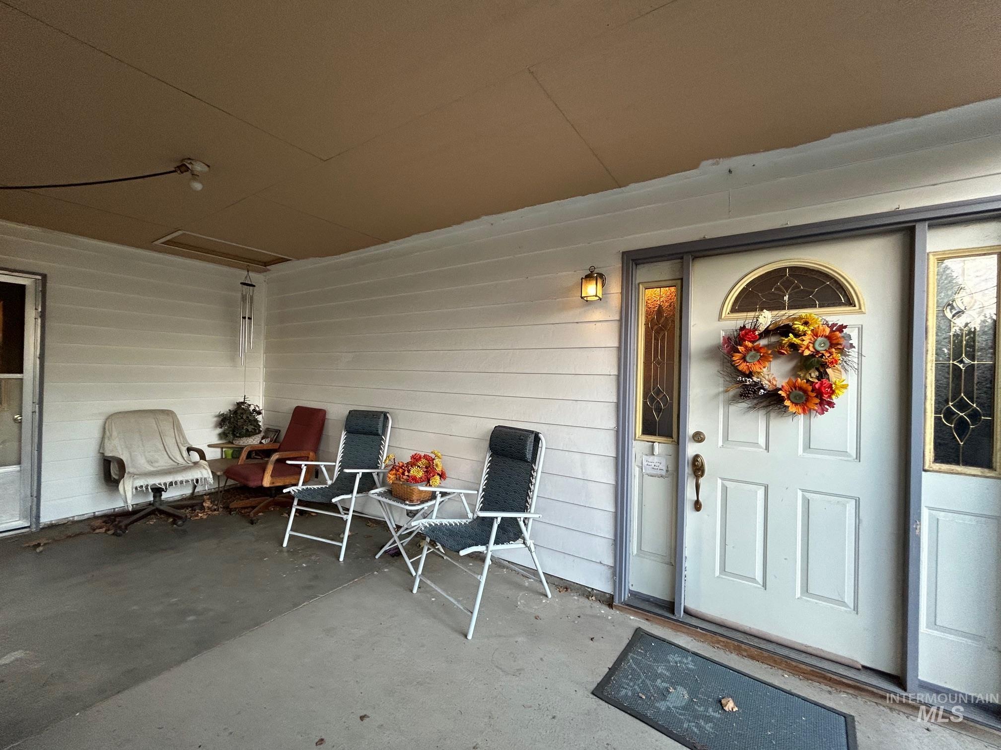 Doorway to property with a patio