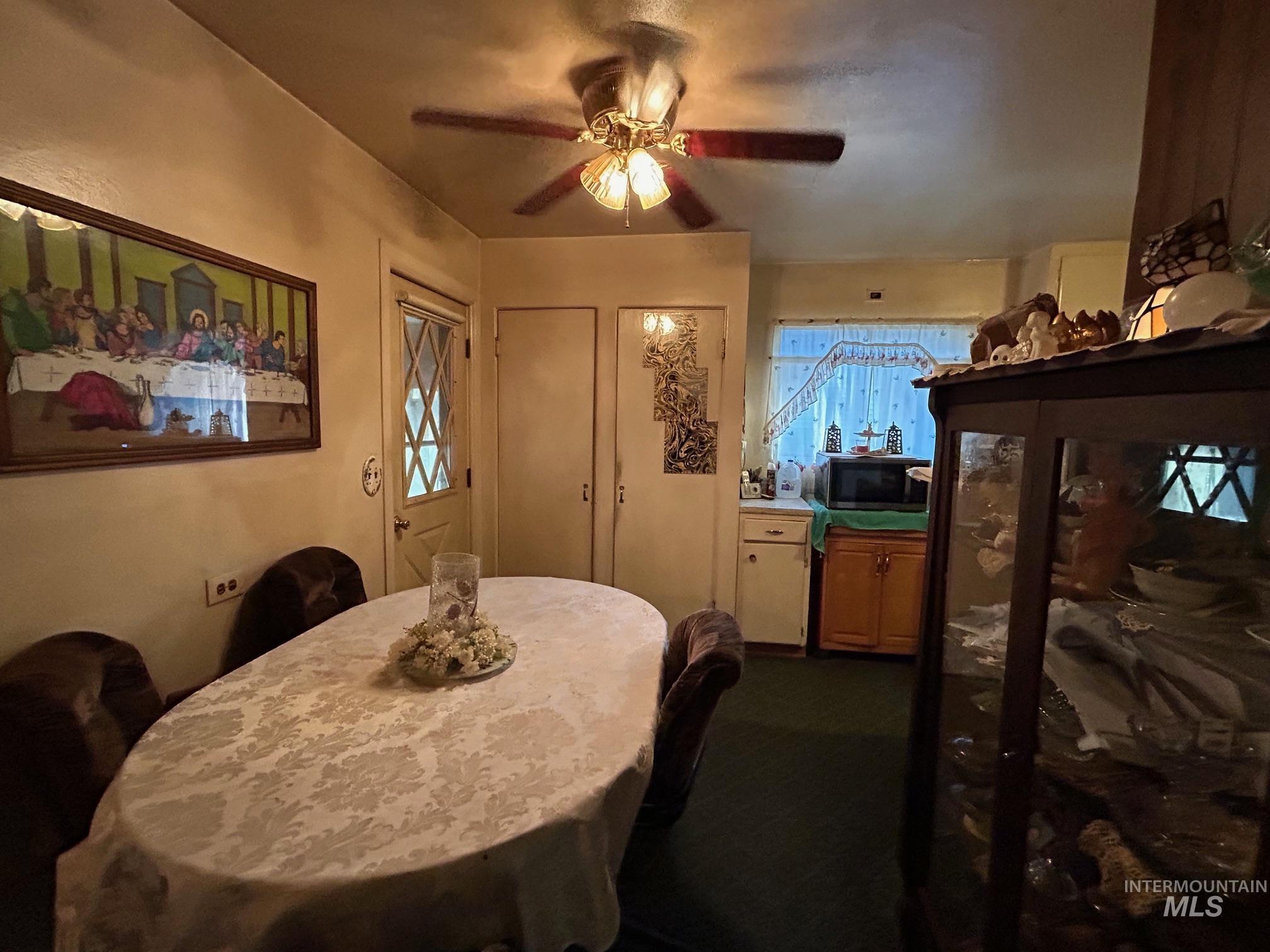 Dining space with a ceiling fan