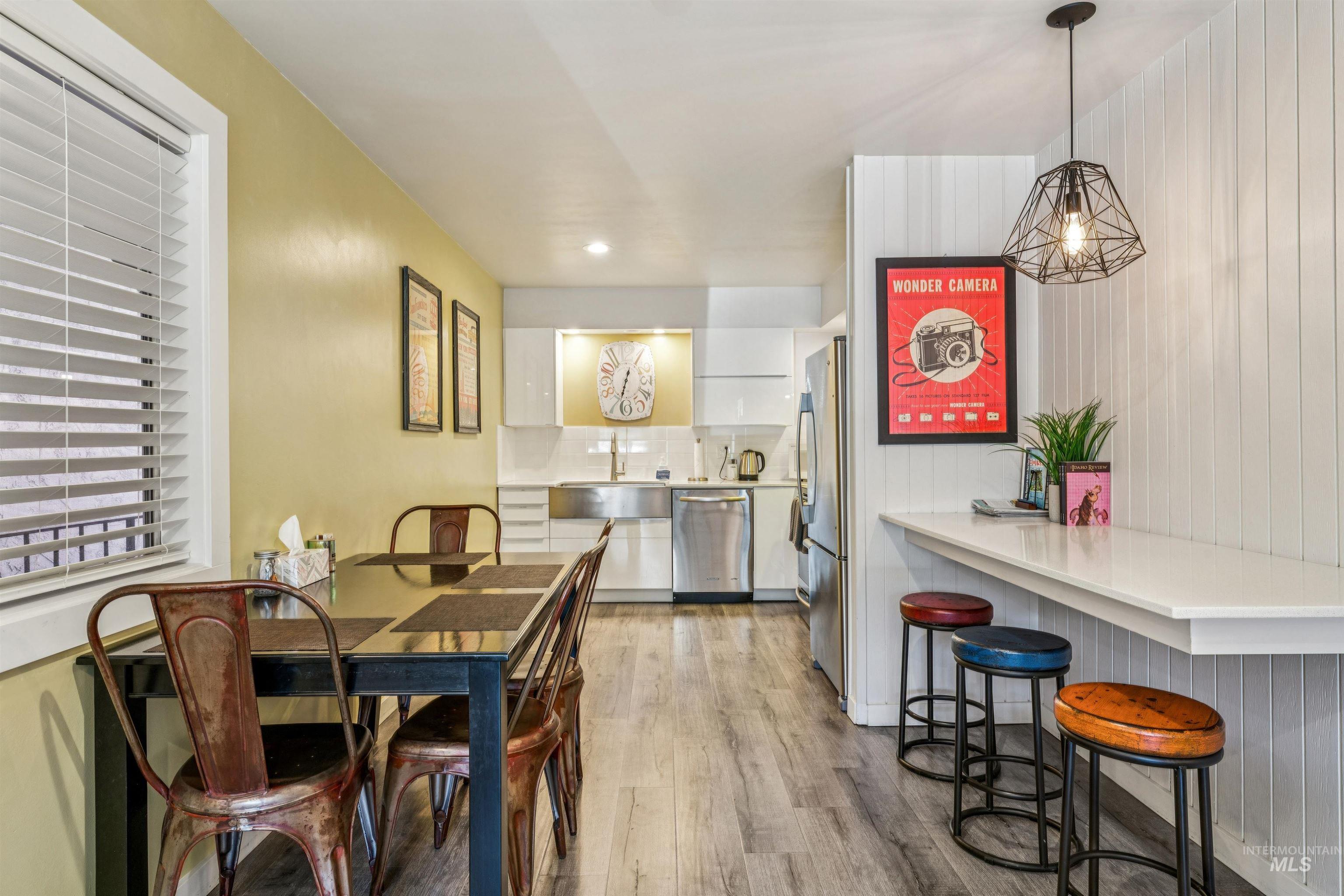 Dining space featuring light wood finished floors and recessed lighting