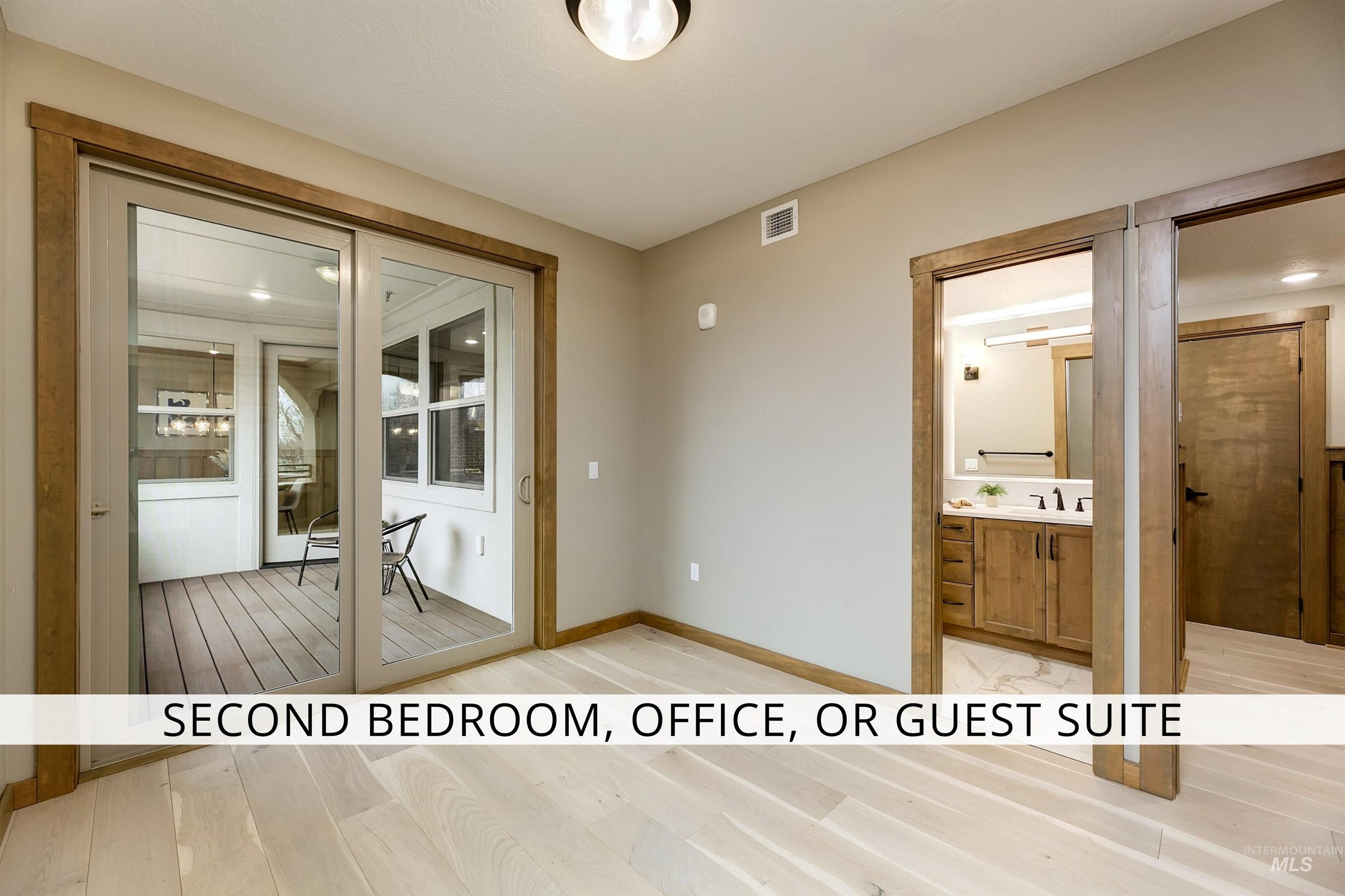 Corridor featuring light wood finished floors and baseboards