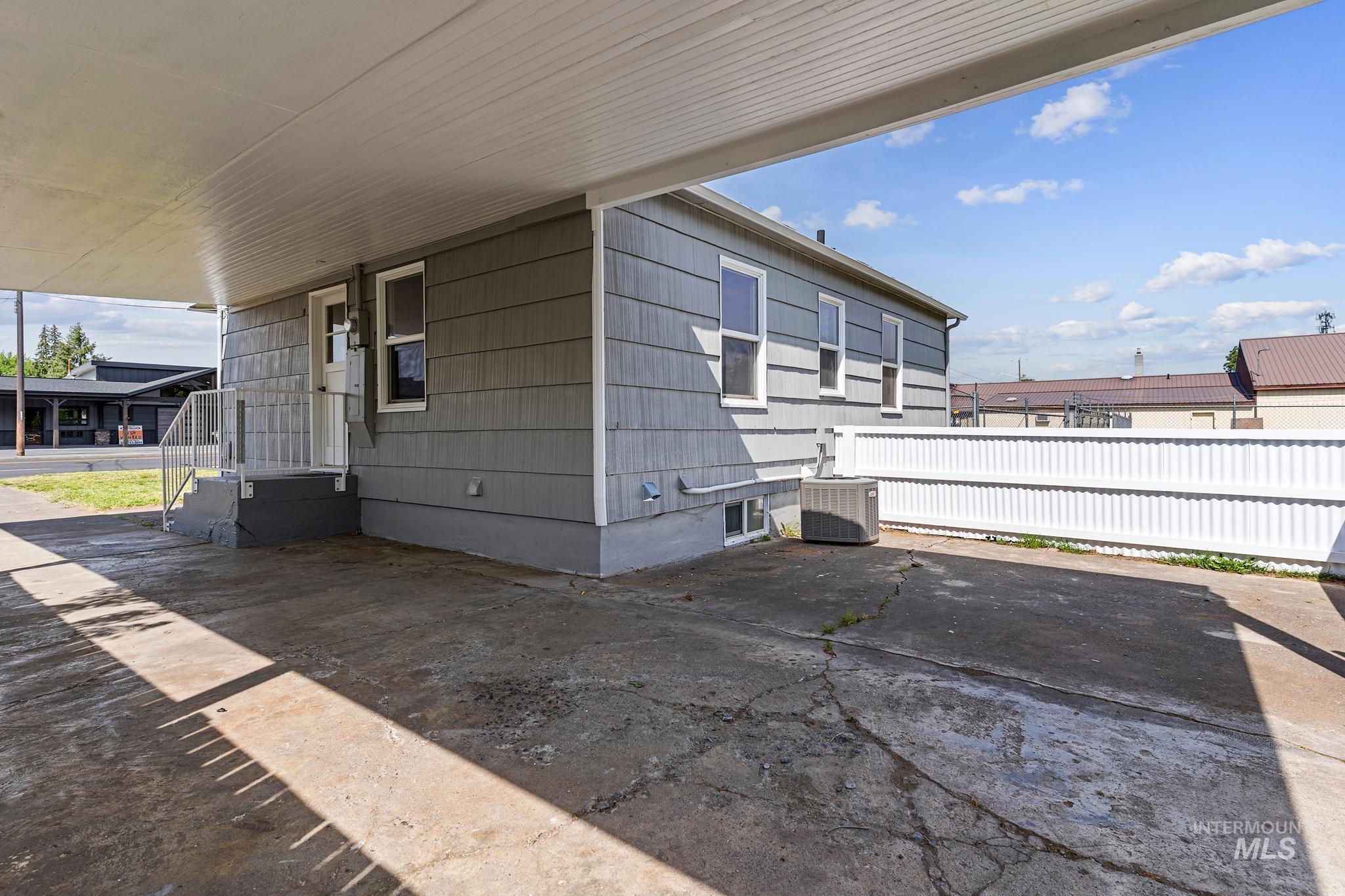 Covered carport with concrete surface