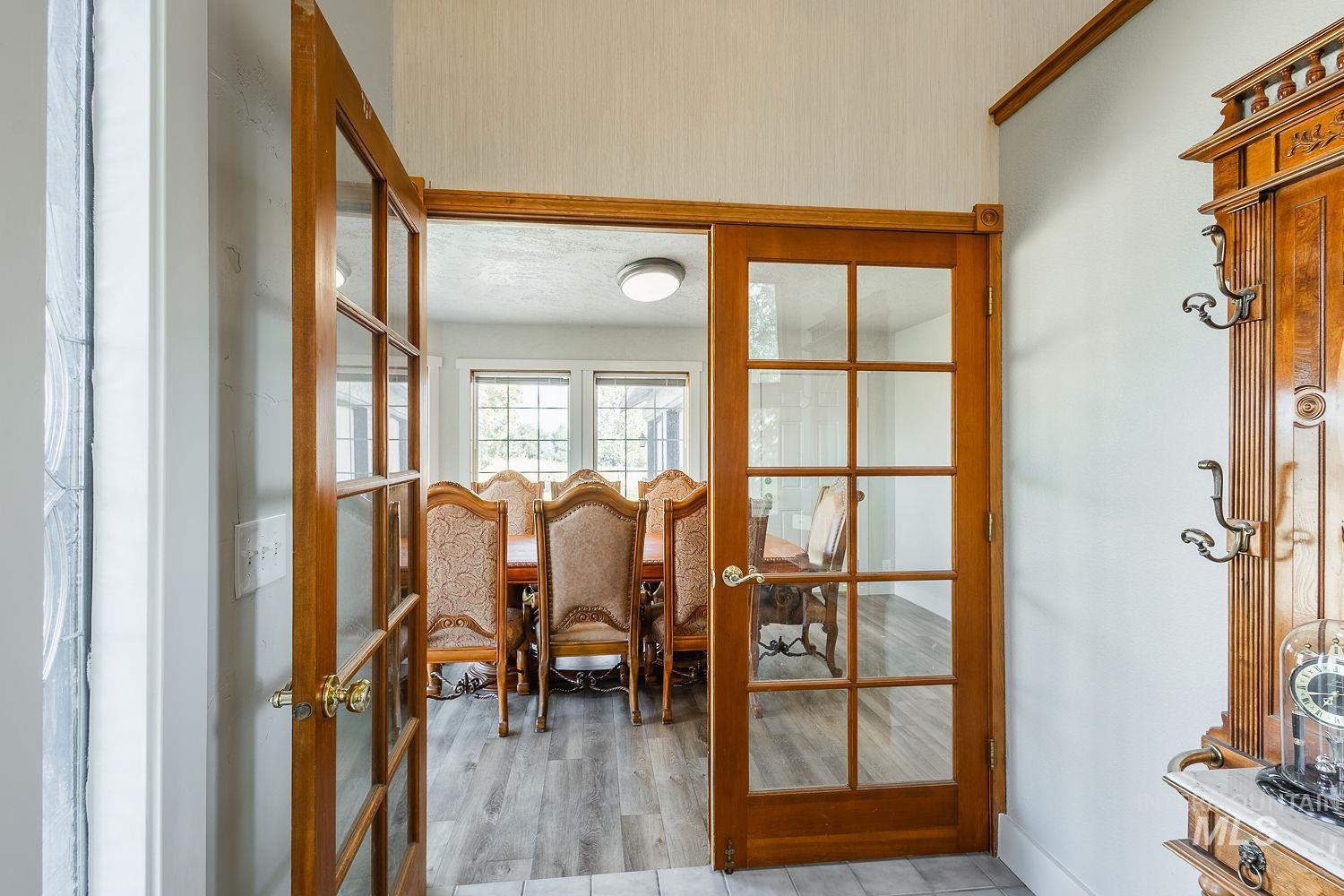 Doorway featuring french doors and wood finished floors