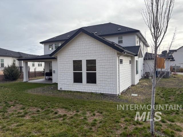 Rear view of property with a patio