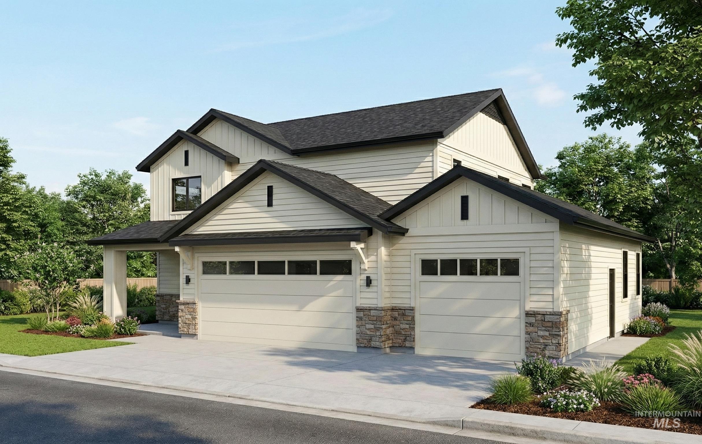 View of front of home featuring a shingled roof, concrete driveway, and board and batten siding