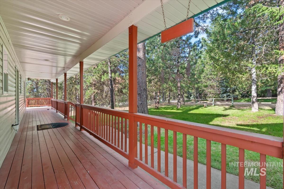 Porch featuring a yard