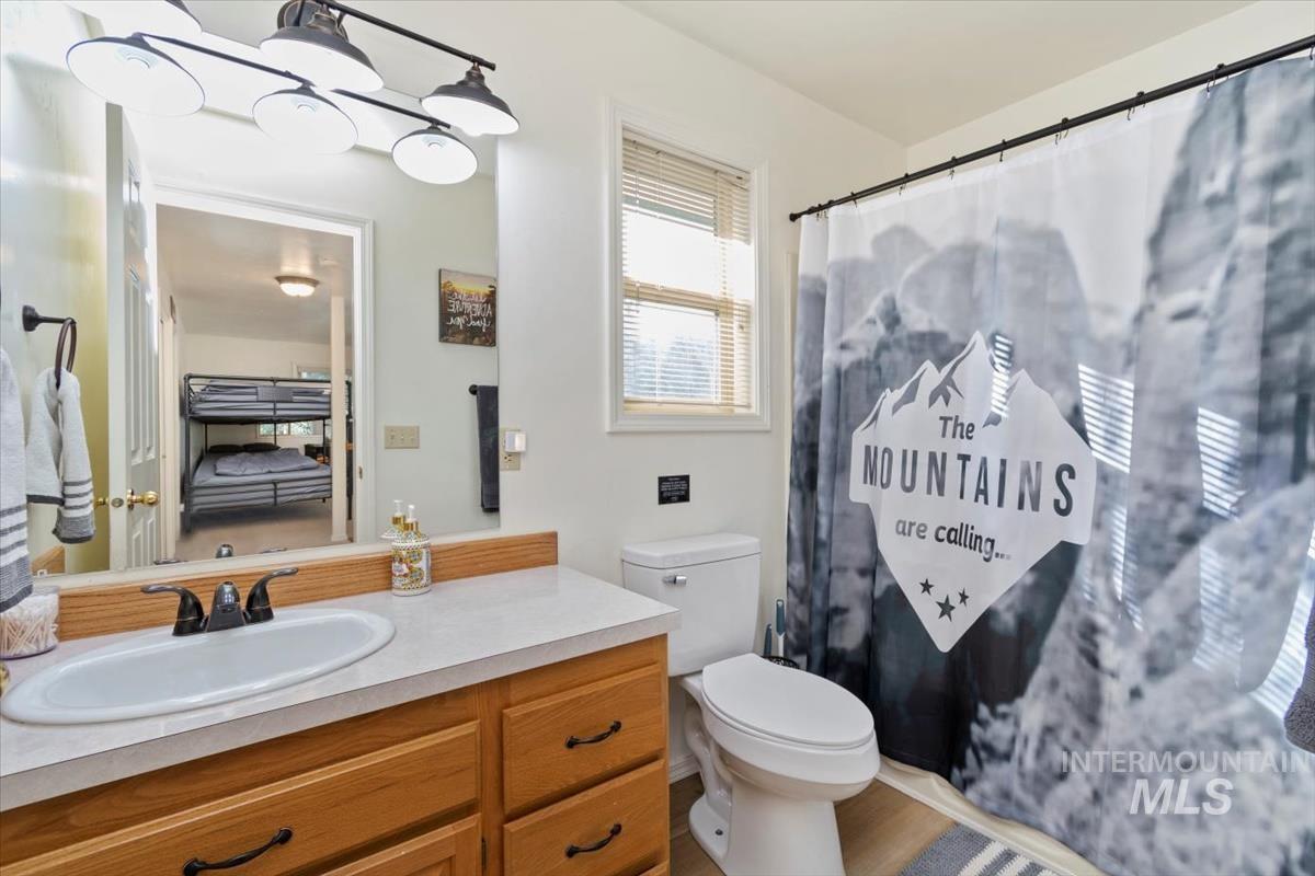 Full bathroom featuring vanity and a shower with curtain