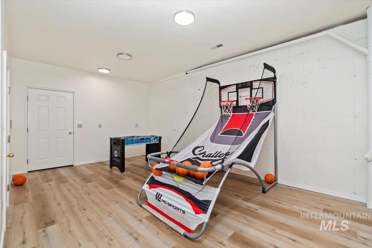 Playroom with light wood-type flooring
