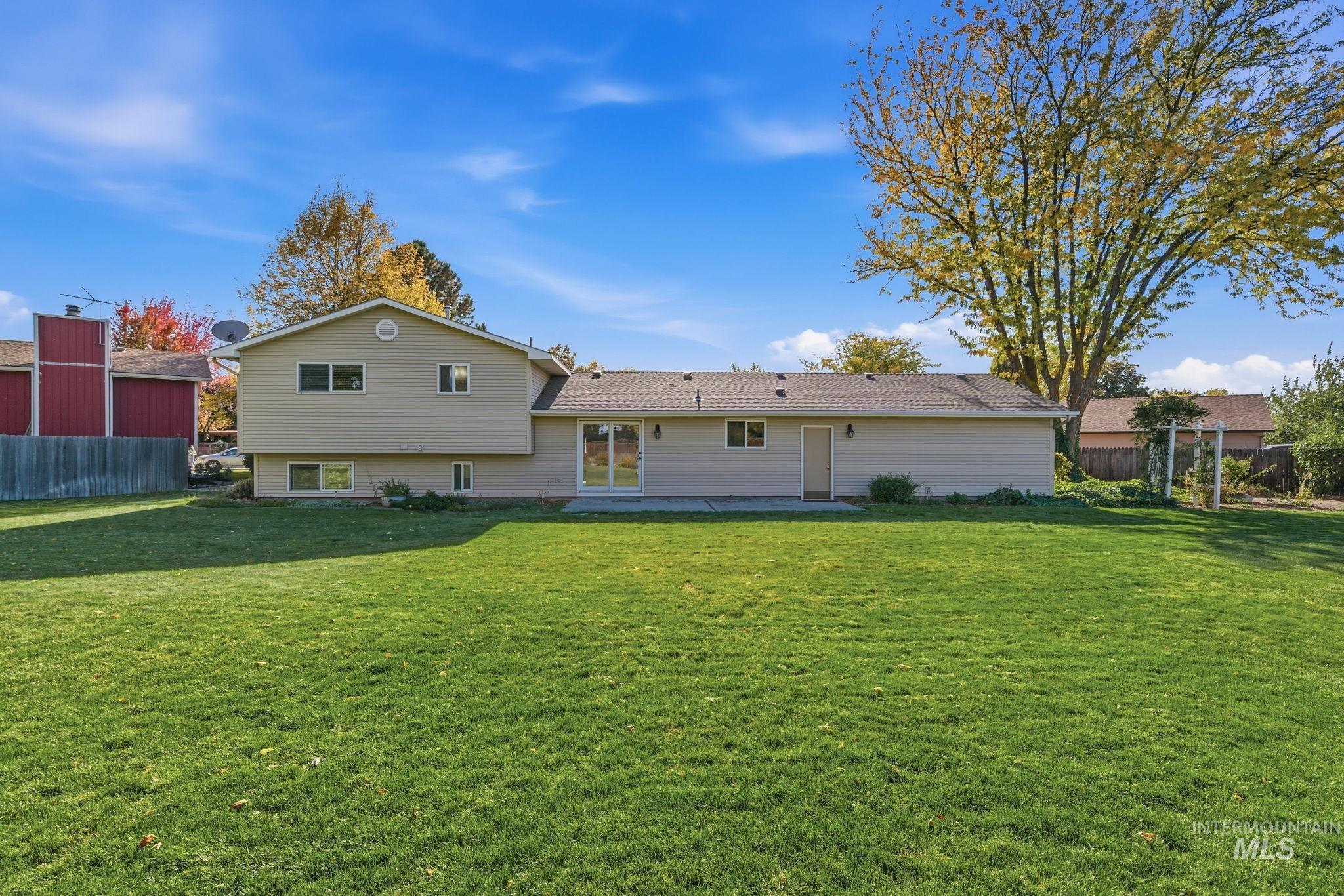 Back of house with a patio