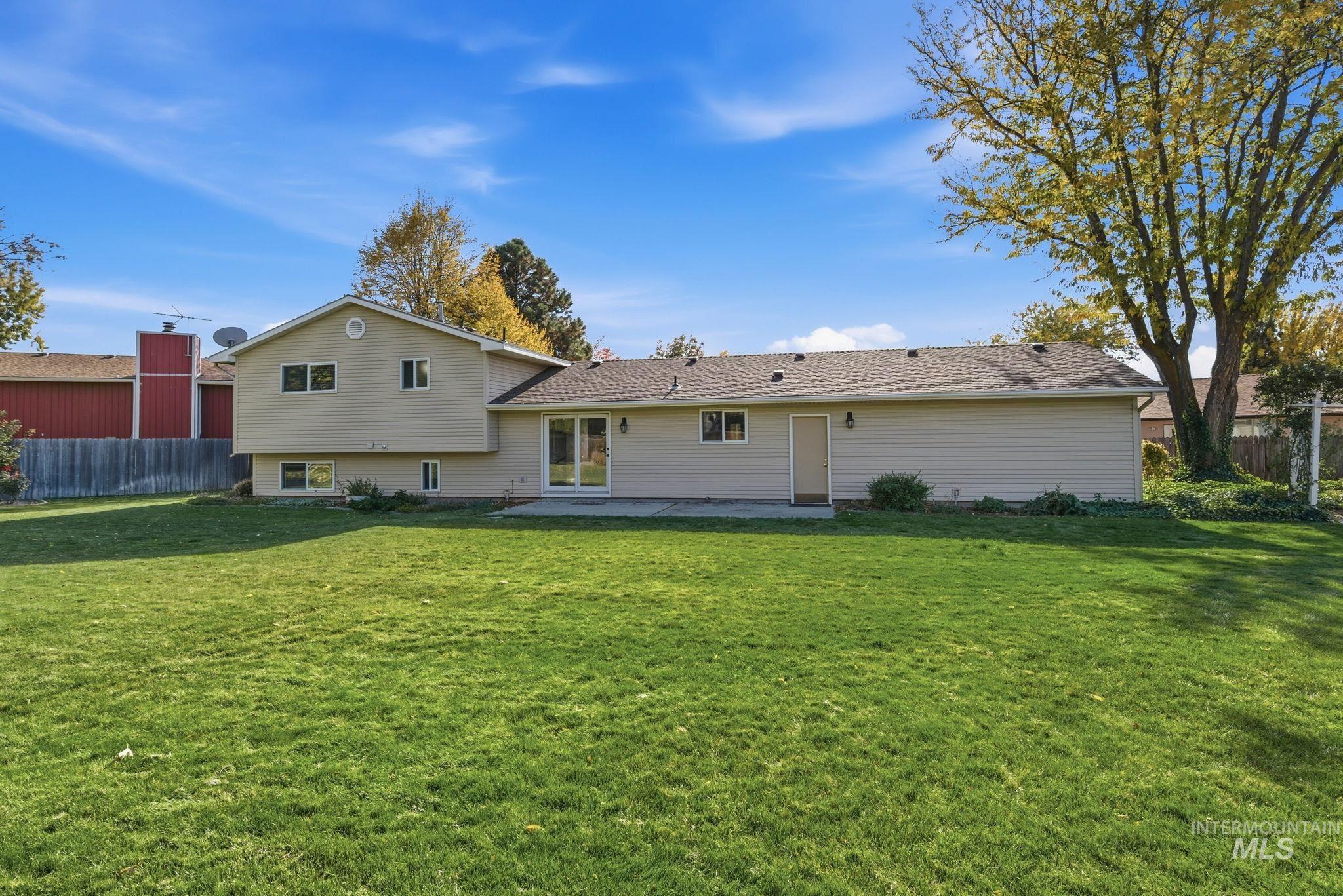 Back of property featuring a patio area
