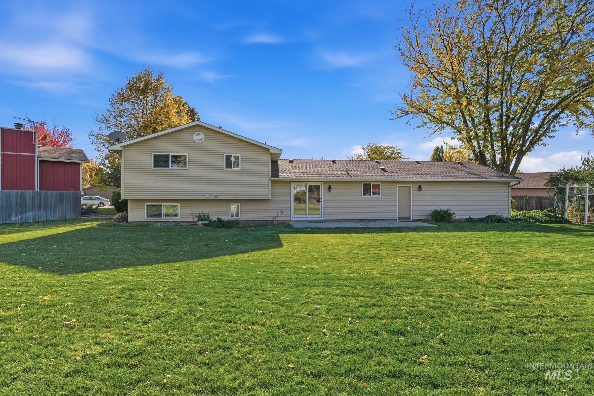 Rear view of property with a patio