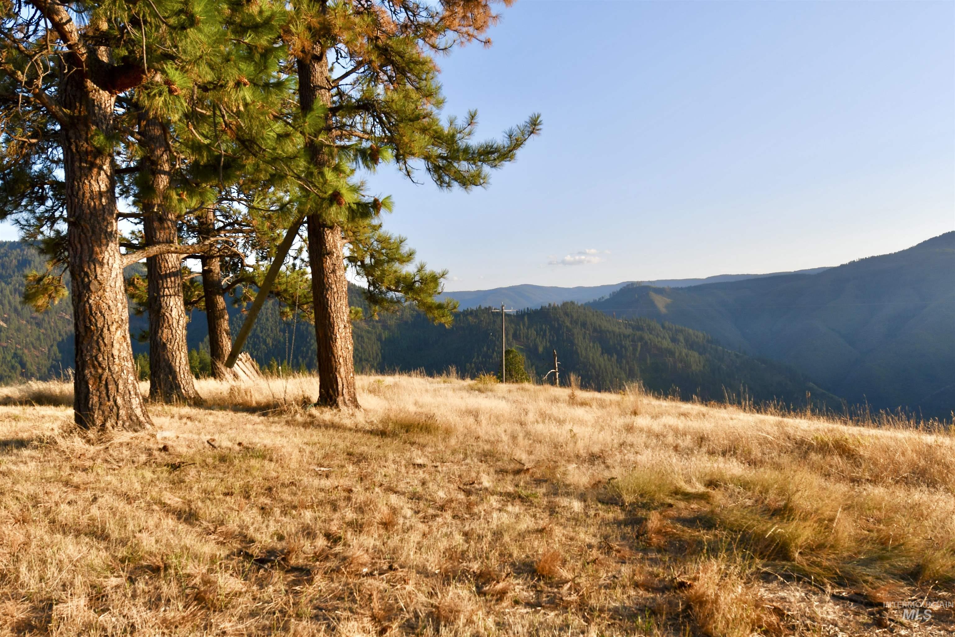 View of mountain background featuring rural landscape