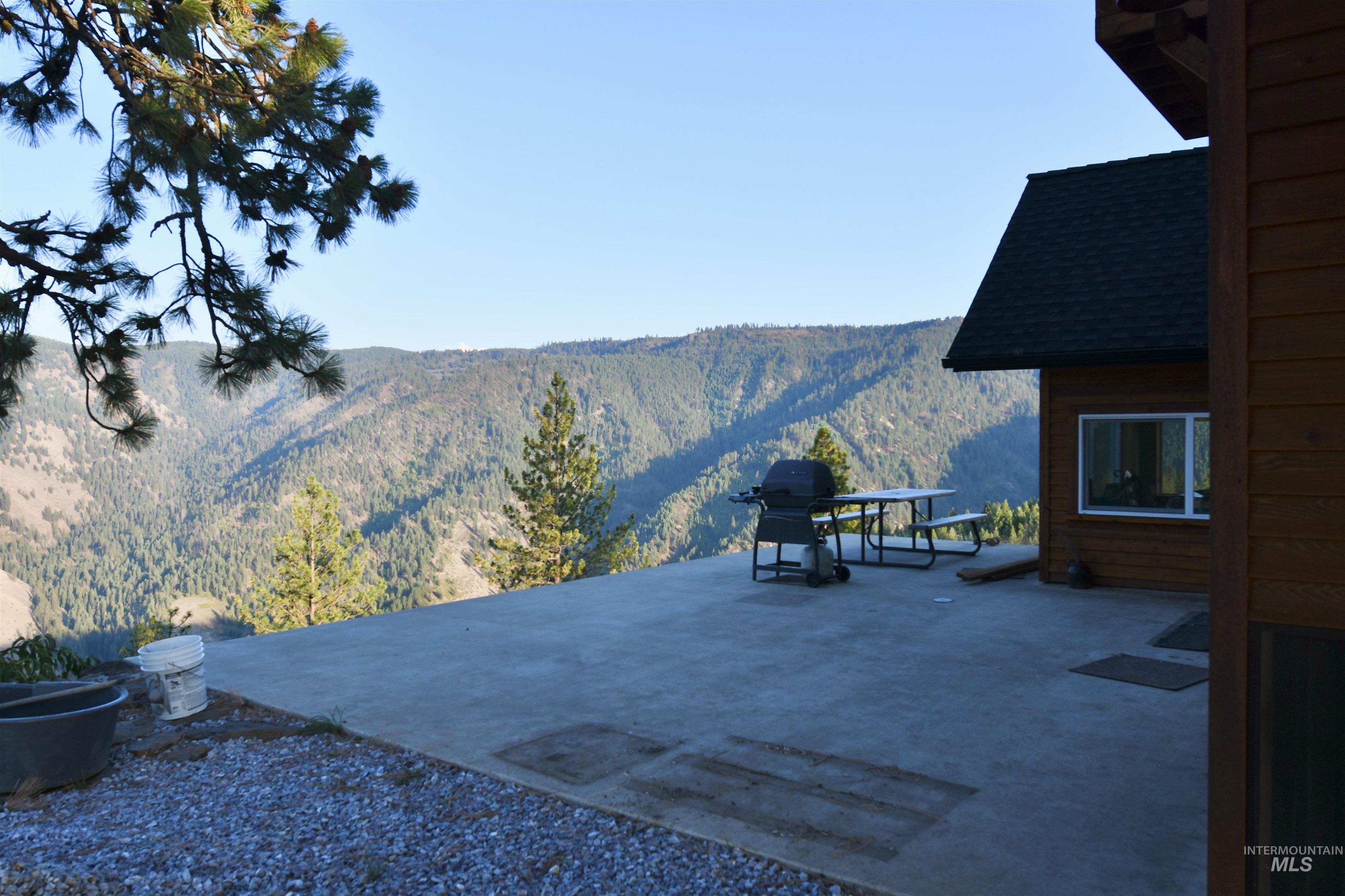 View of patio featuring a mountain view and grilling area