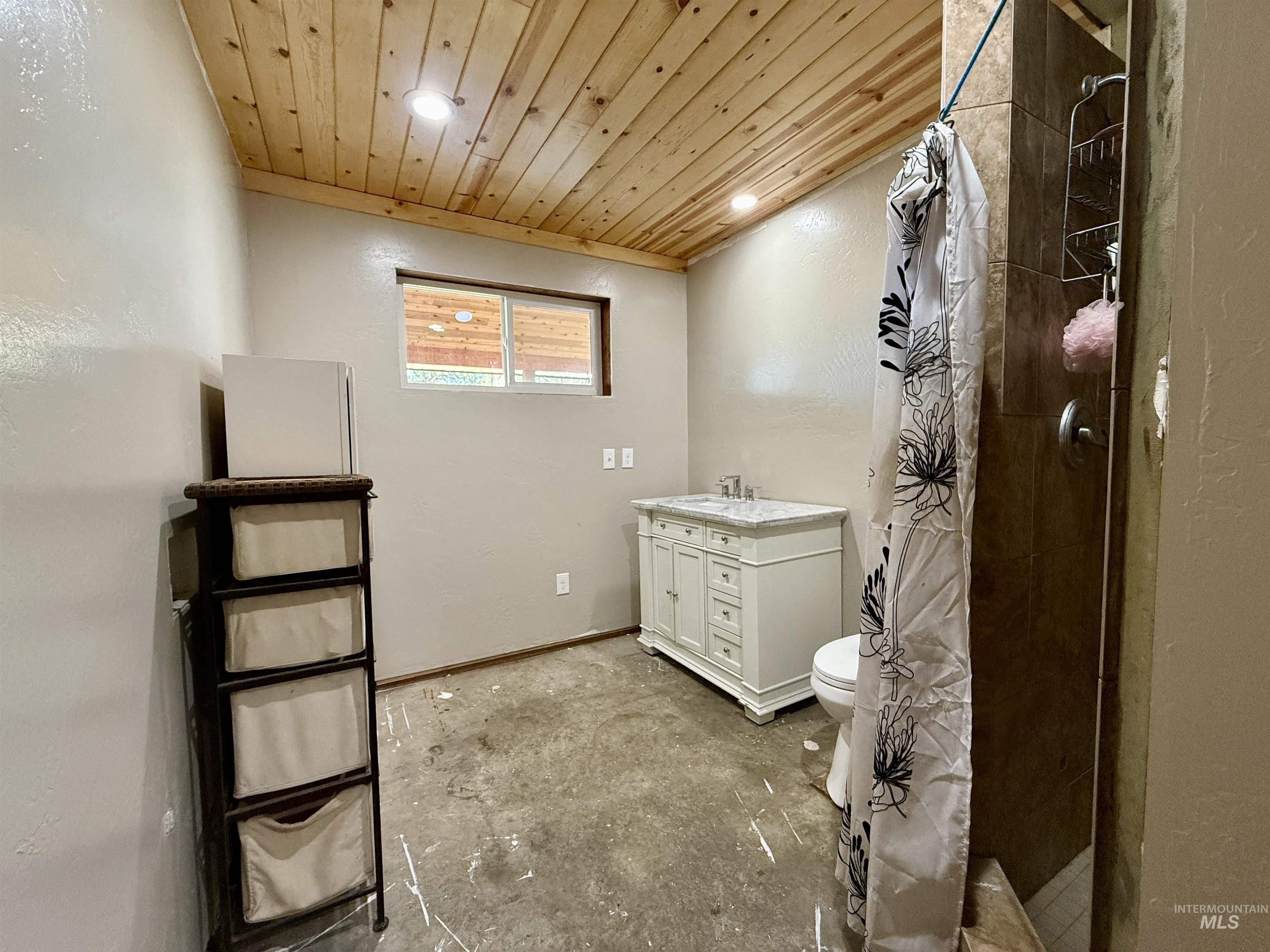 Bathroom with a shower stall, vanity, recessed lighting, and wooden ceiling
