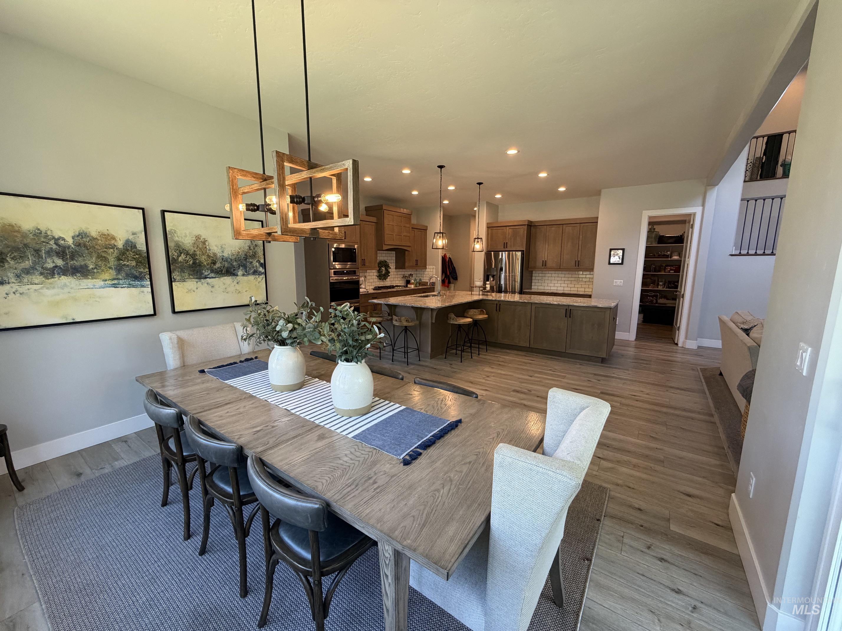 Open-concept living space featuring wood-finish flooring throughout