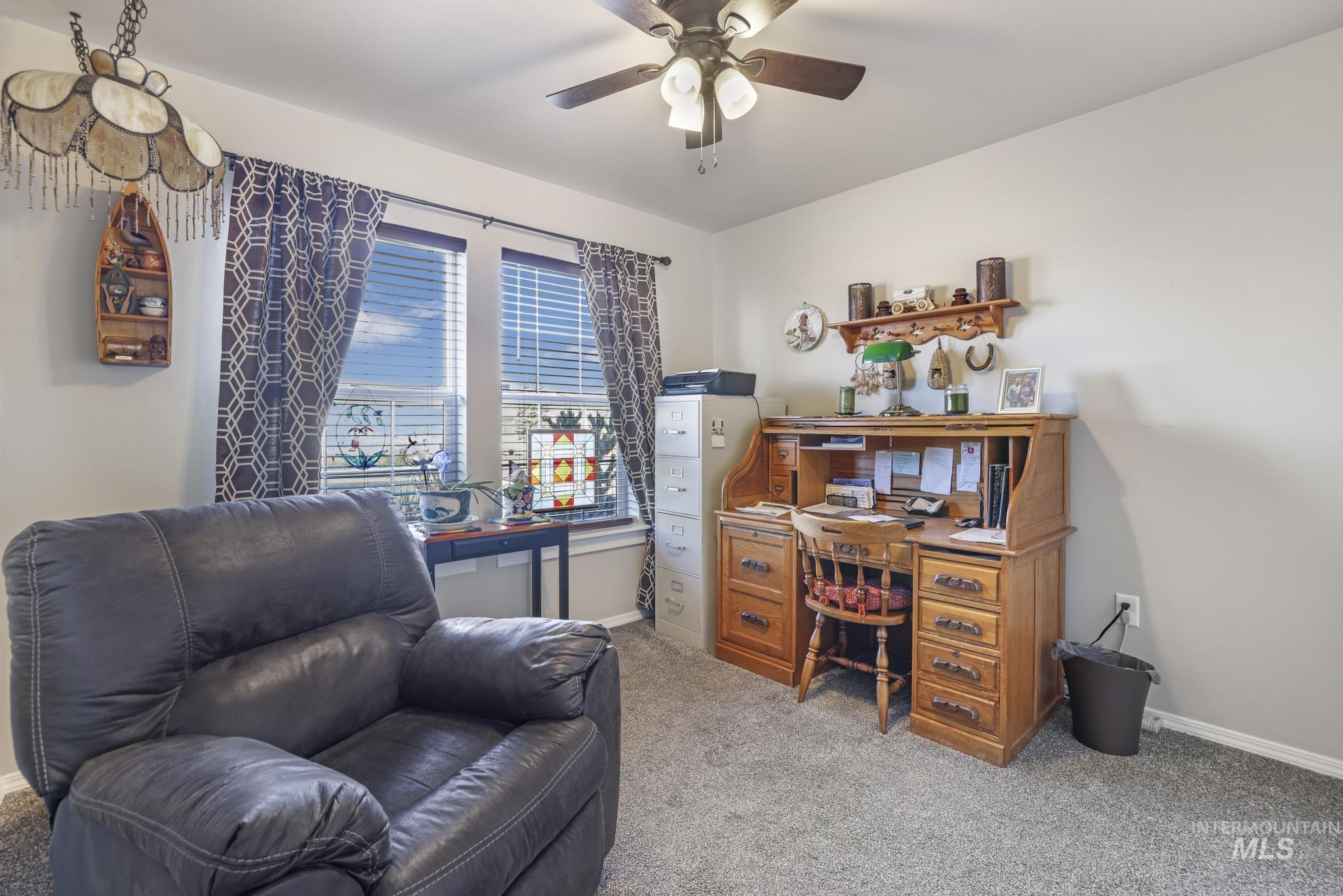 Office featuring carpet floors and a ceiling fan