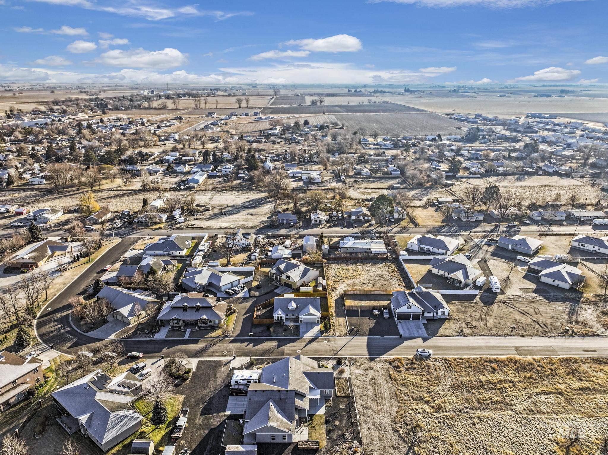 View of property location with nearby suburban area