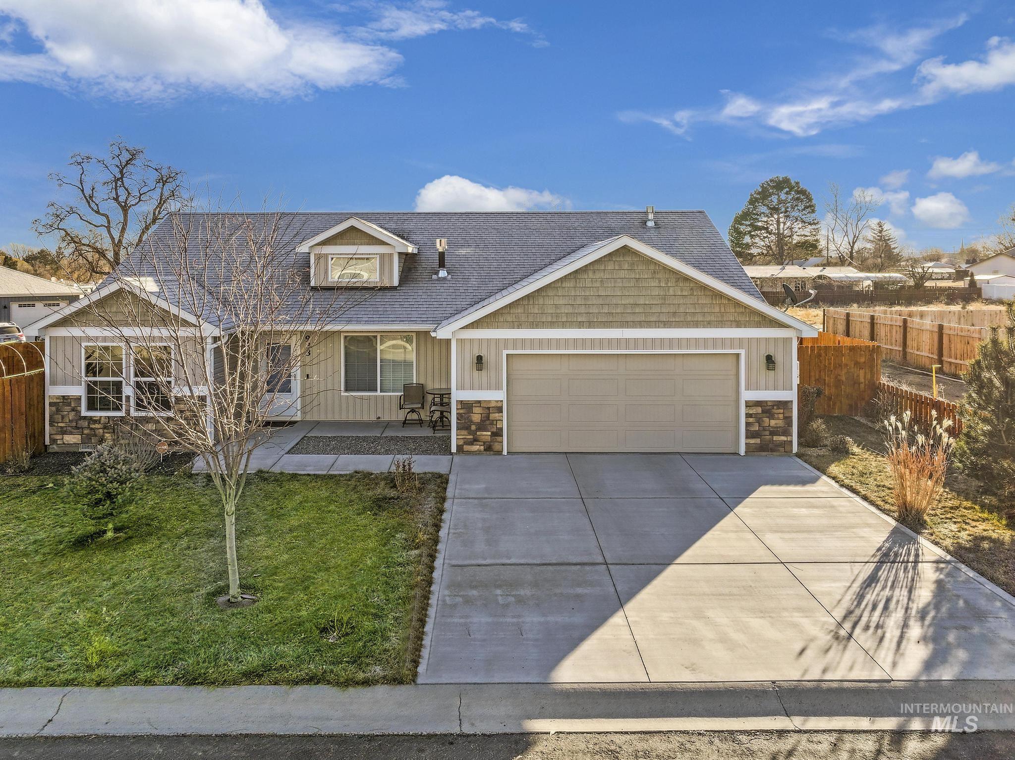 Craftsman inspired home featuring stone siding, a porch, concrete driveway, an attached garage, and a shingled roof