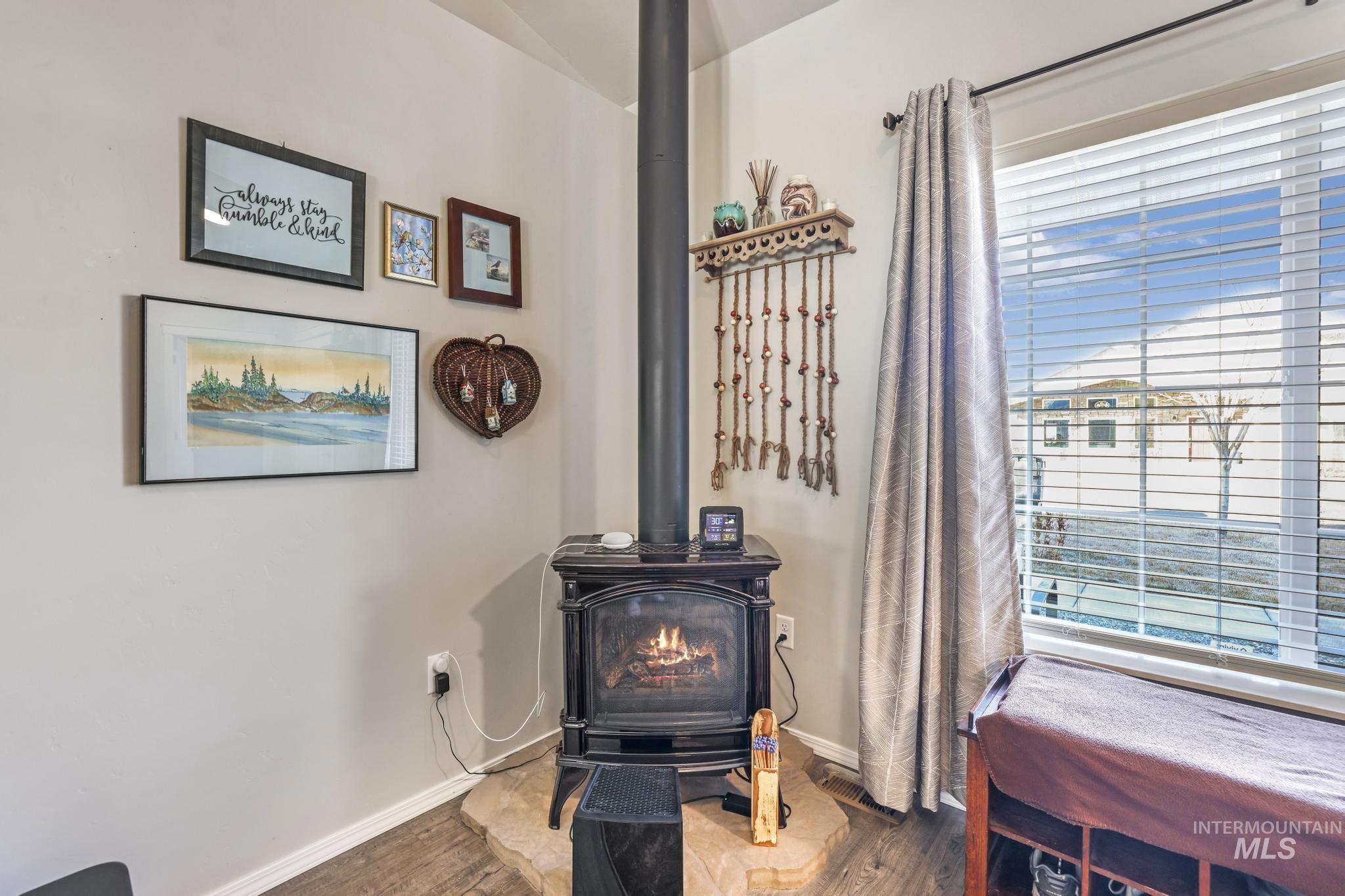 Detailed view of a wood stove and wood finished floors
