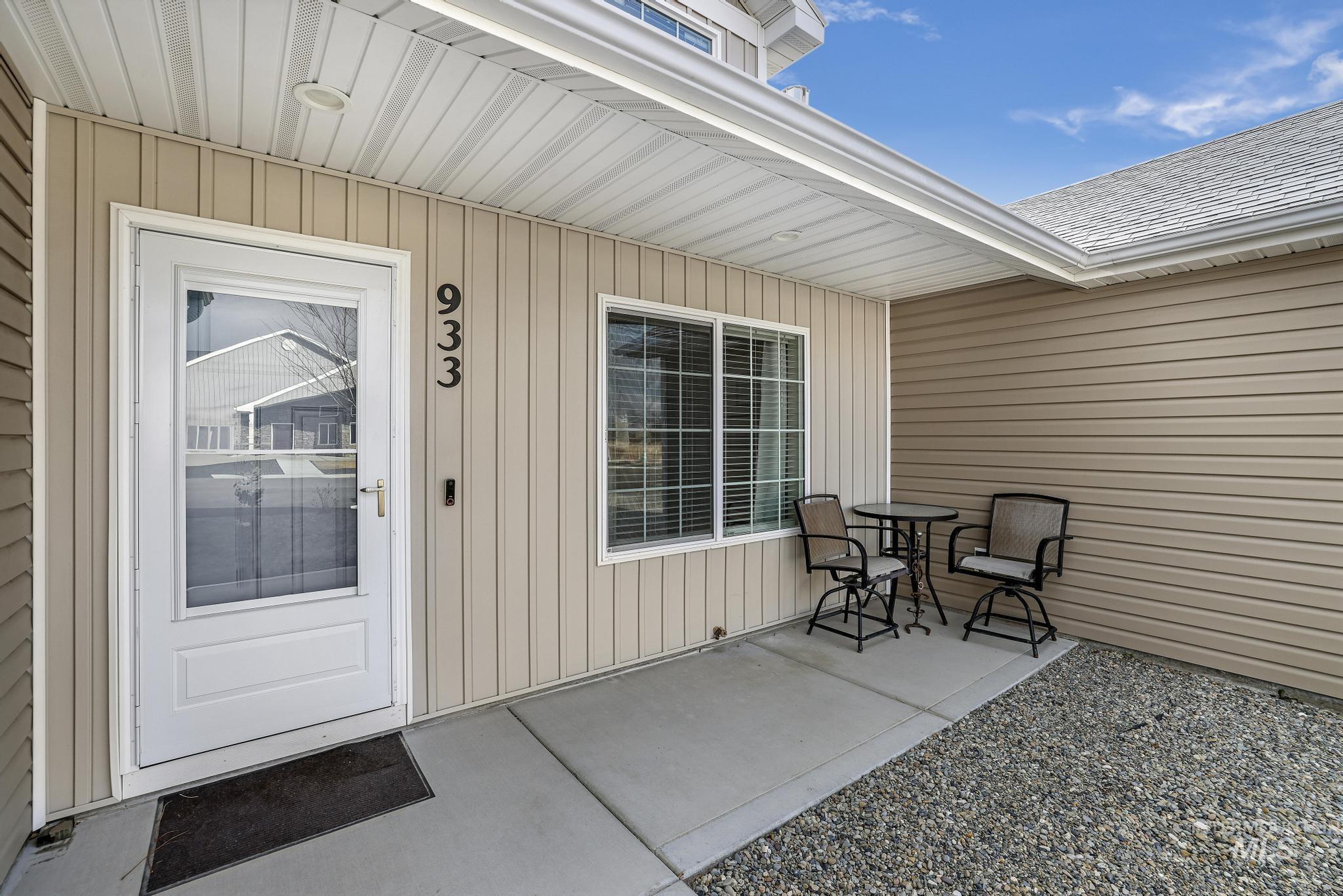 Entrance to property with a shingled roof