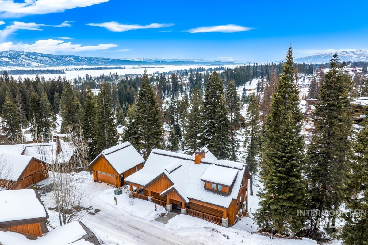 View from above of property with a mountain backdrop