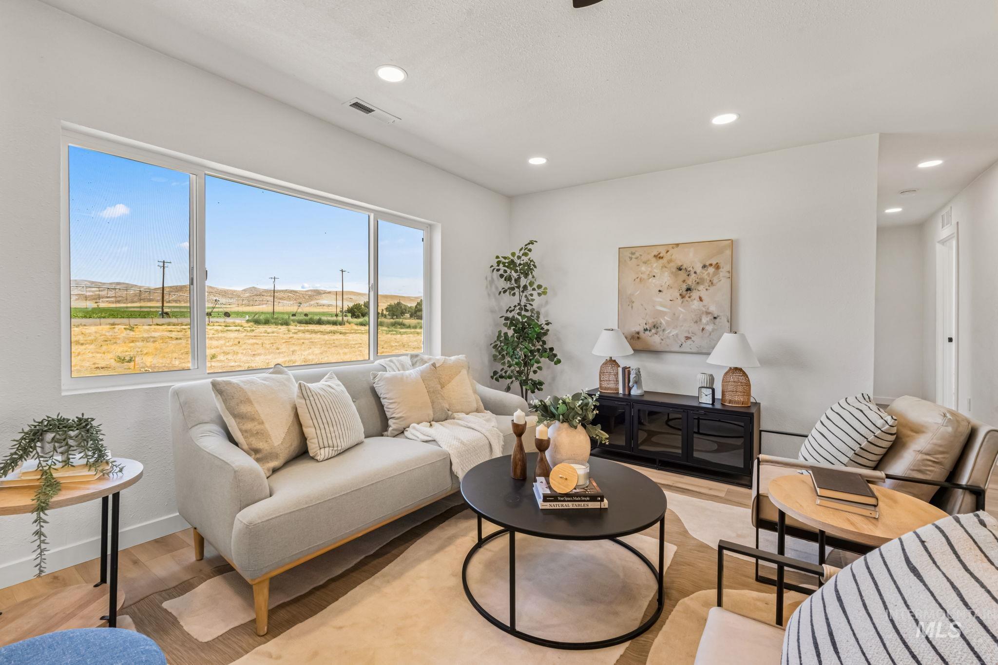 Living area featuring recessed lighting and light wood-style floors