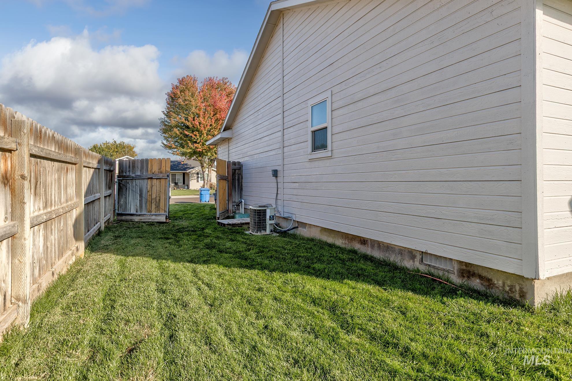 View of property exterior featuring a cooling unit