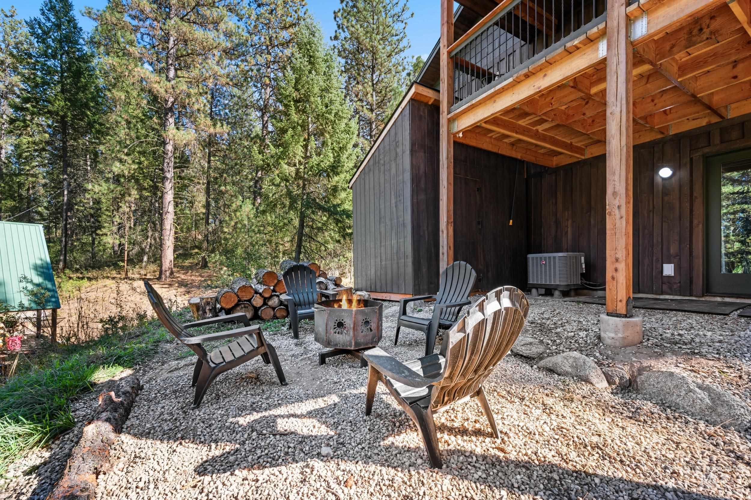 Patio / terrace with a patio area and an outdoor fire pit