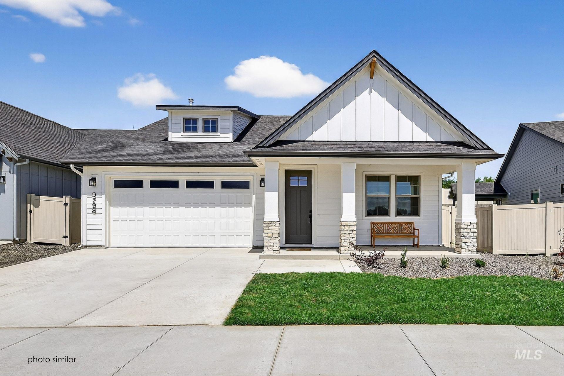 Modern farmhouse featuring a shingled roof, board and batten siding, a porch, driveway, and an attached garage