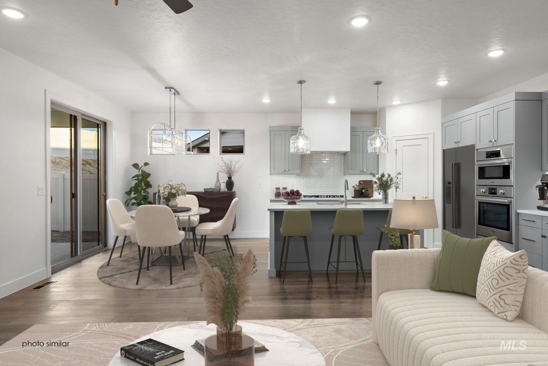Living room featuring light wood-type flooring, recessed lighting, and a ceiling fan
