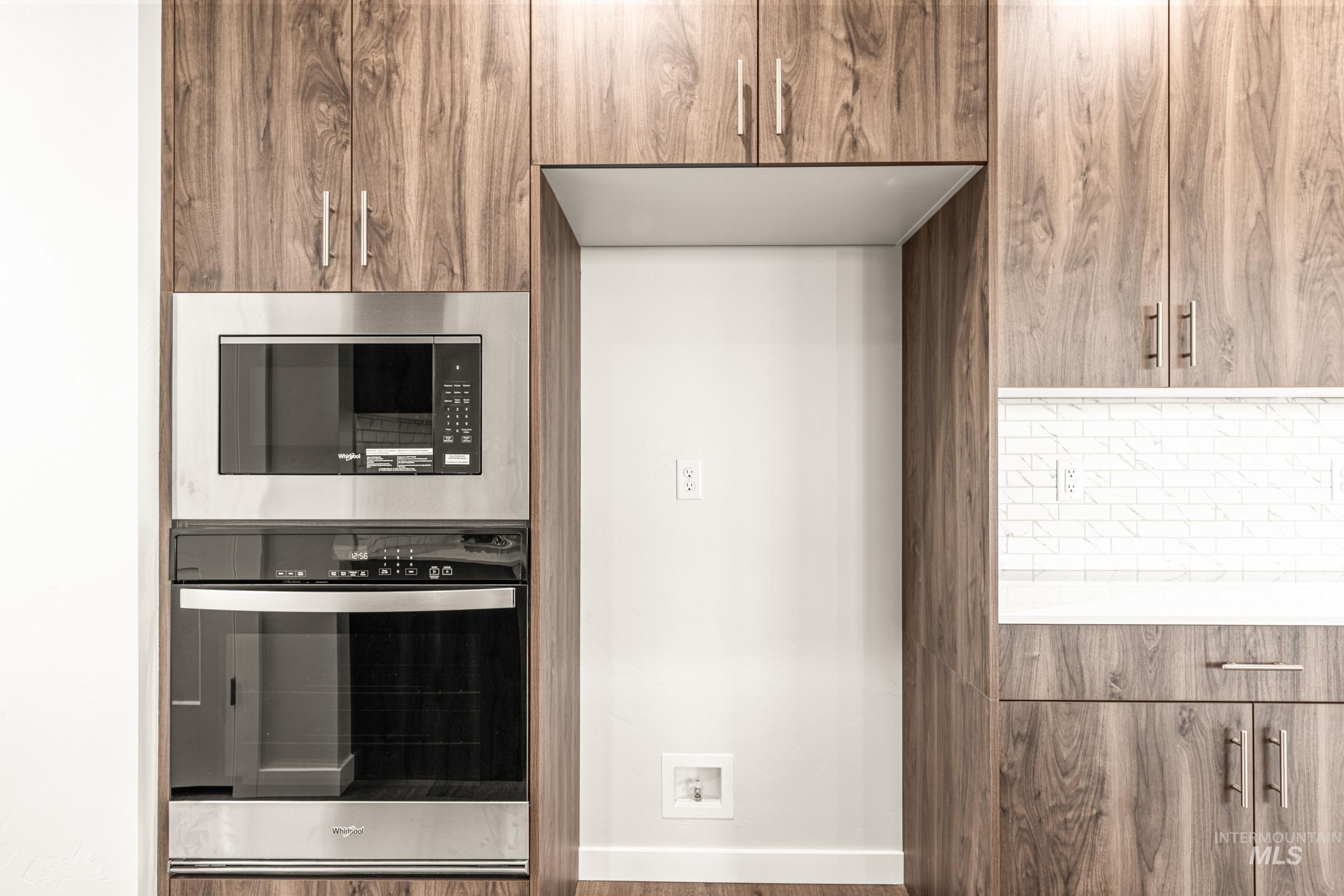 Integrated stainless steel microwave and oven combination
