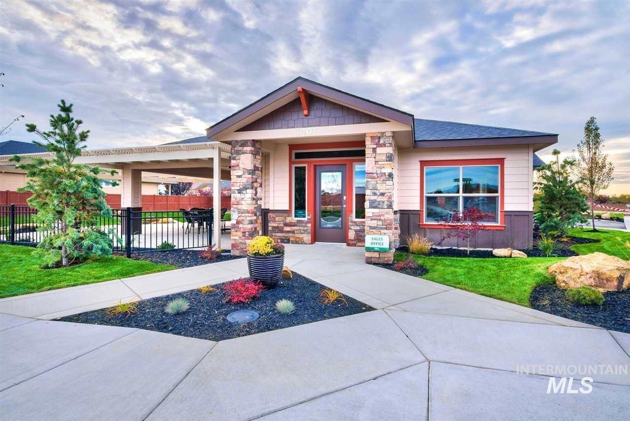 Contemporary building with a stone facade accent, covered entry, and large windows