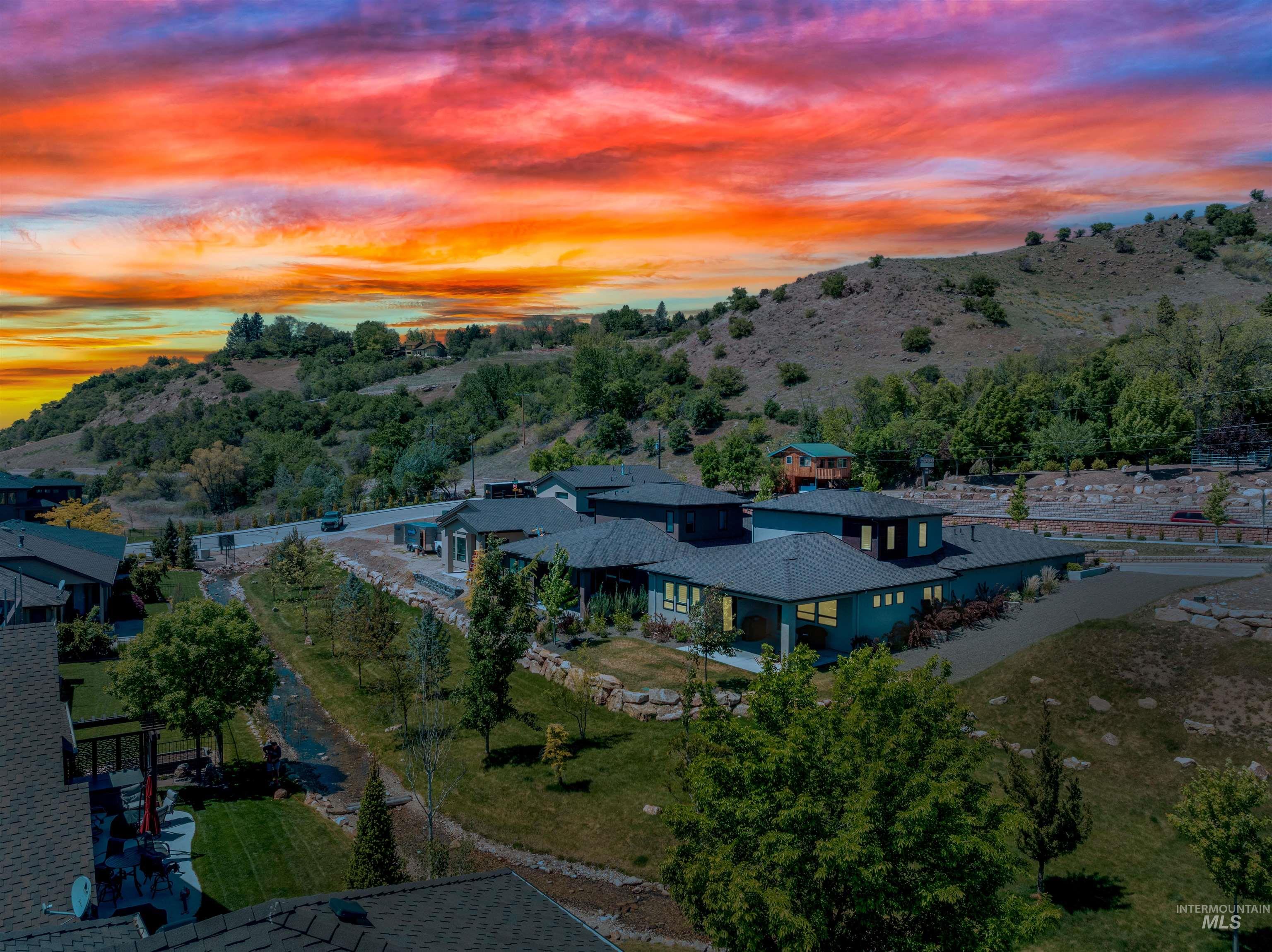 Aerial view at dusk of a residential view and a mountain view