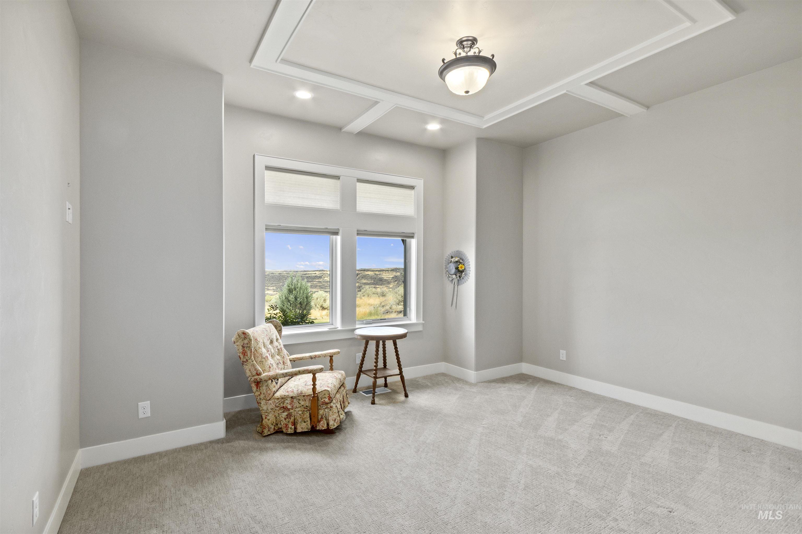 Living area featuring carpet flooring and recessed lighting