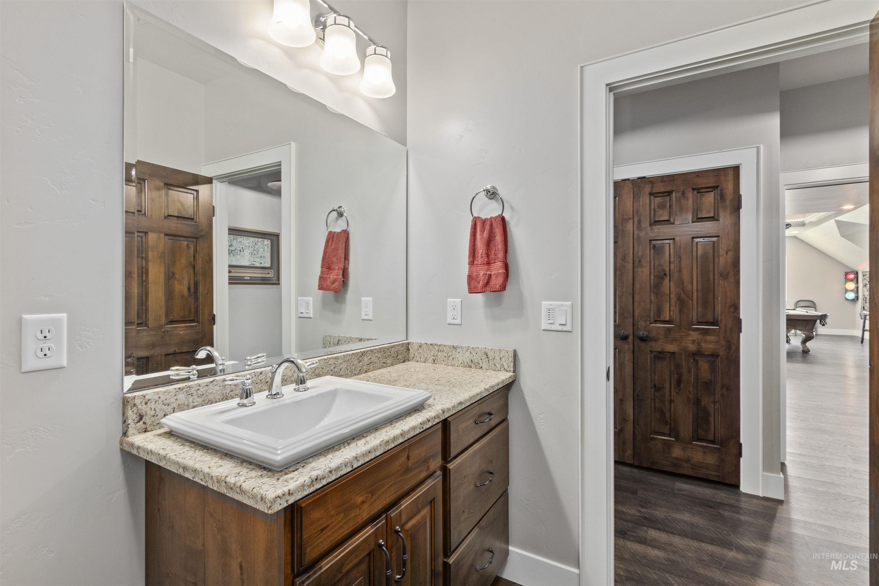 Bathroom featuring wood finished floors and vanity