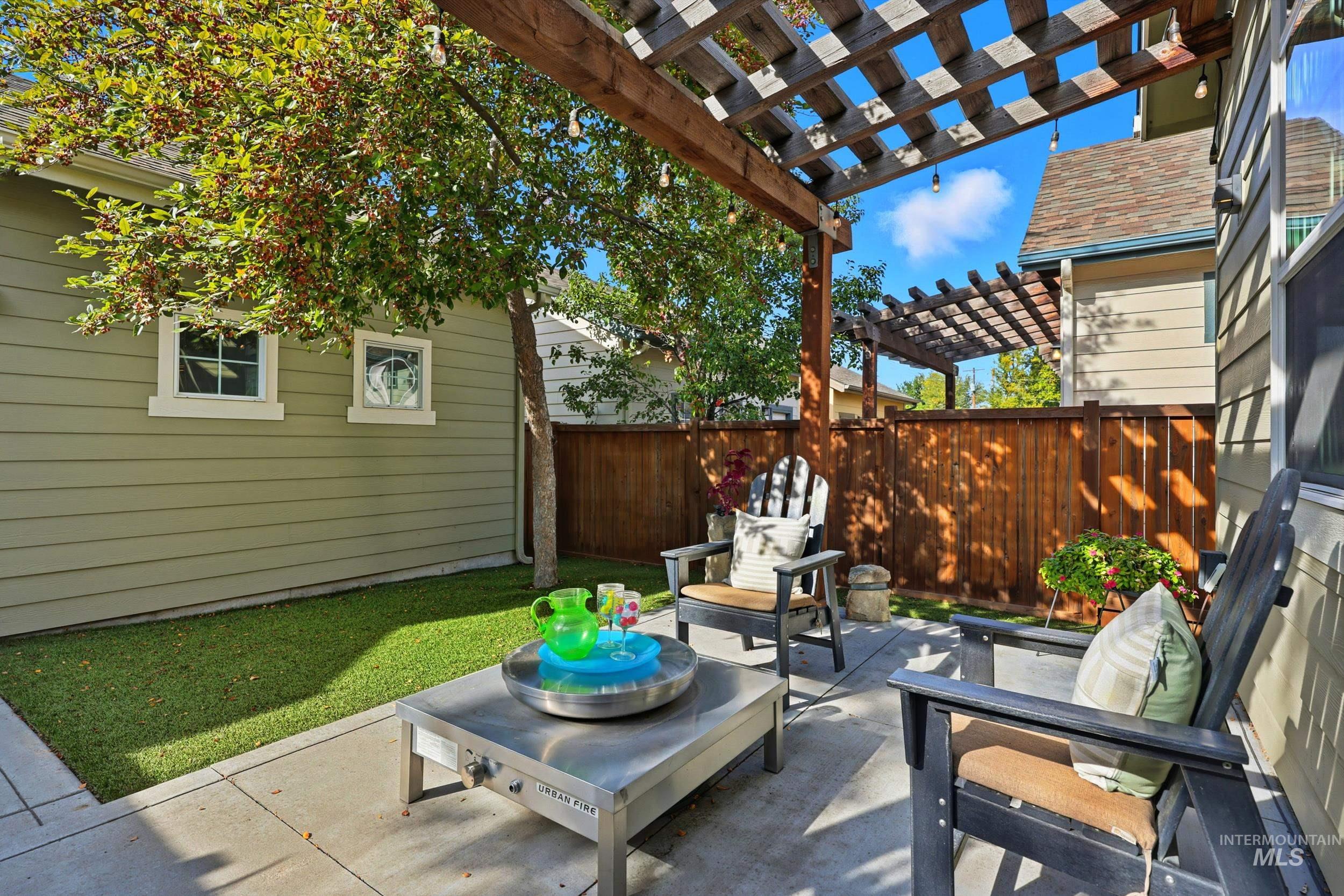 View of patio featuring a pergola and outdoor lounge area