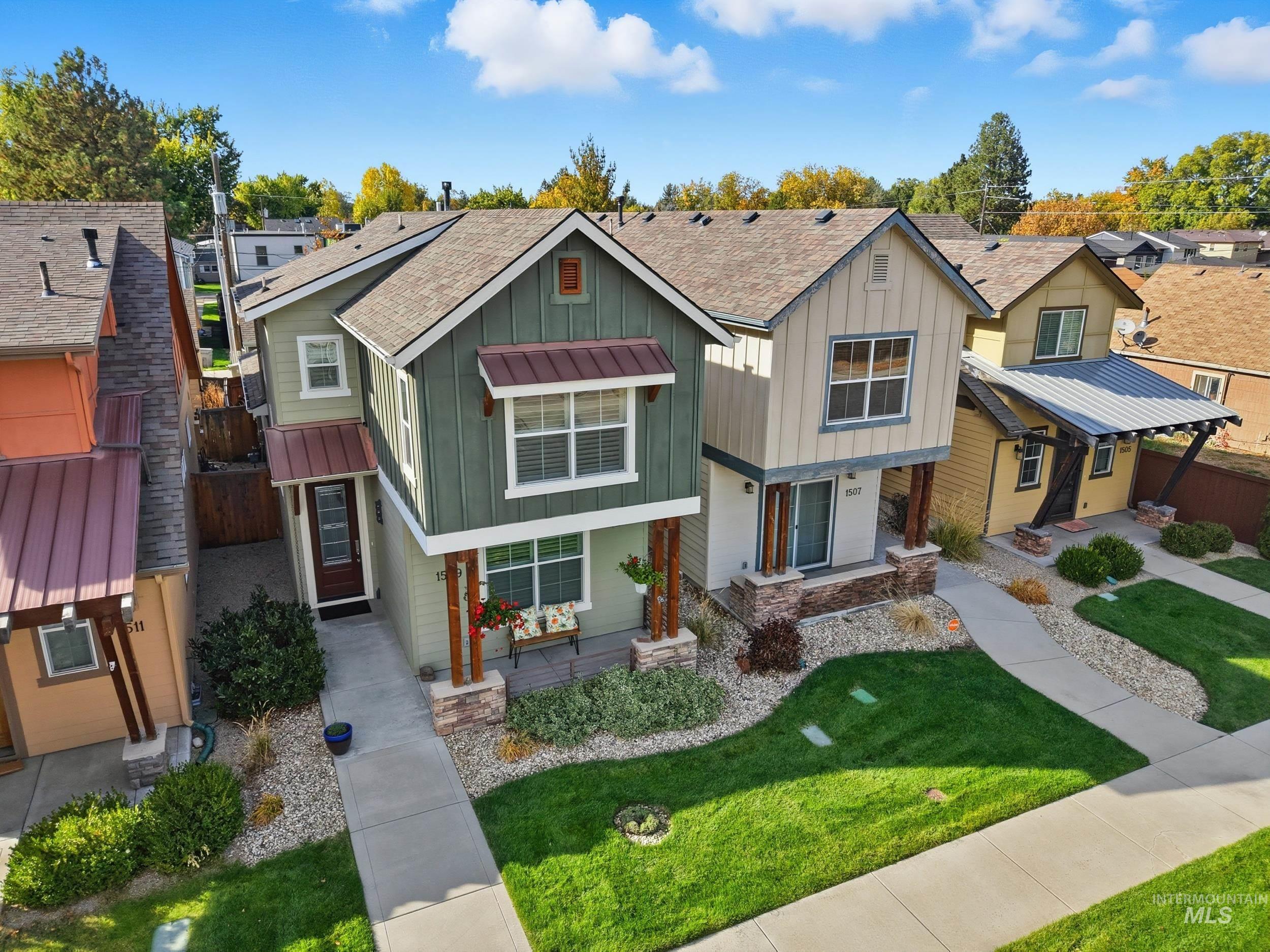 Craftsman house featuring board and batten siding, roof with shingles, and a residential view