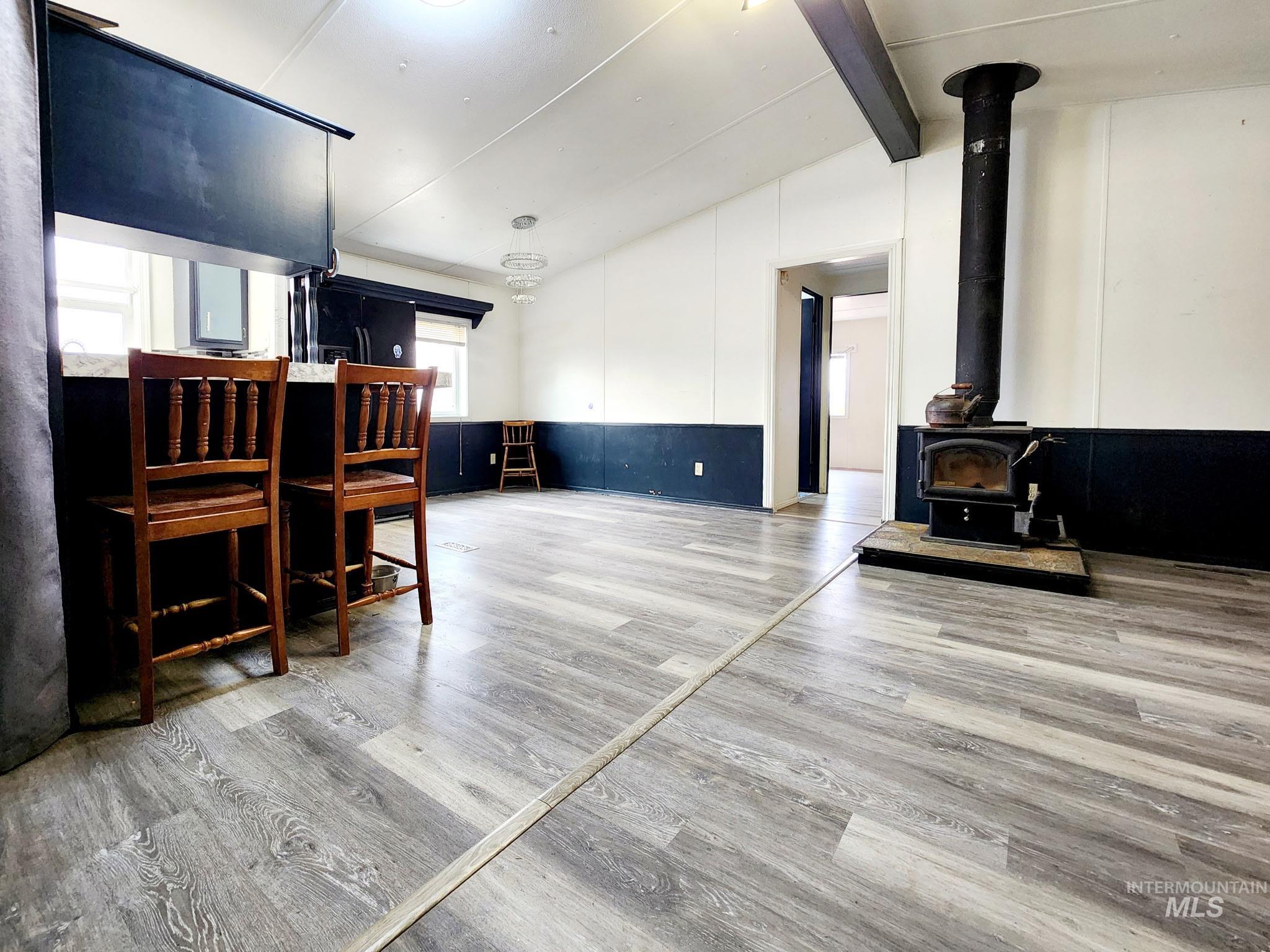 Living room showing kitchen area and breakfast bar